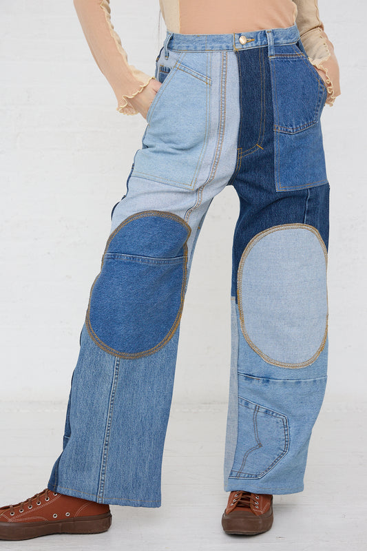 A woman wearing a pair of WildRootz Reworked Jeans in Blue, crafted from recycled denim, by a sustainable streetwear brand.