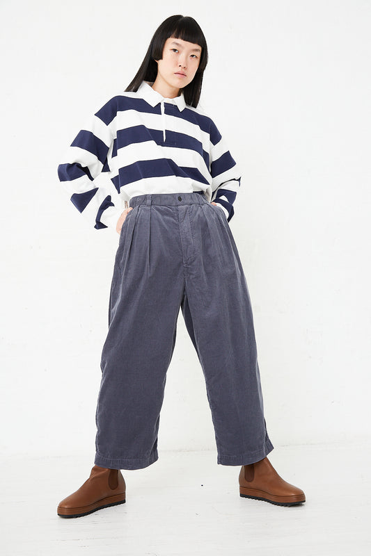A woman wearing the Corduroy In-Pleat Baggy Pant in Ink Blue by Toujours.
