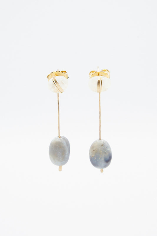 A pair of Mary MacGill Sculpture Earrings in Cottonwood II with blue and white beads.