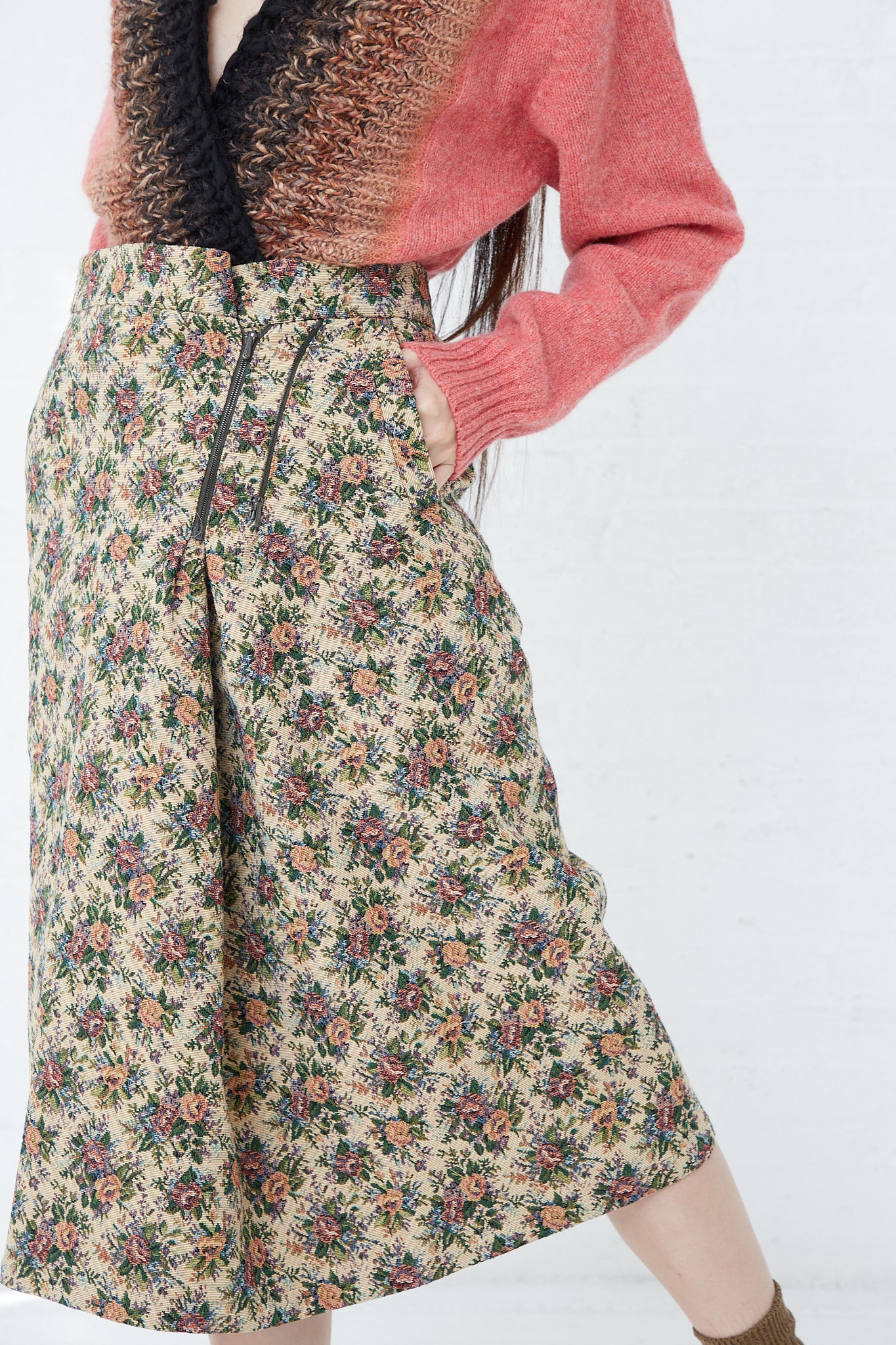 A woman in a Bless SMLXL Skirt No. 75 in Flower.