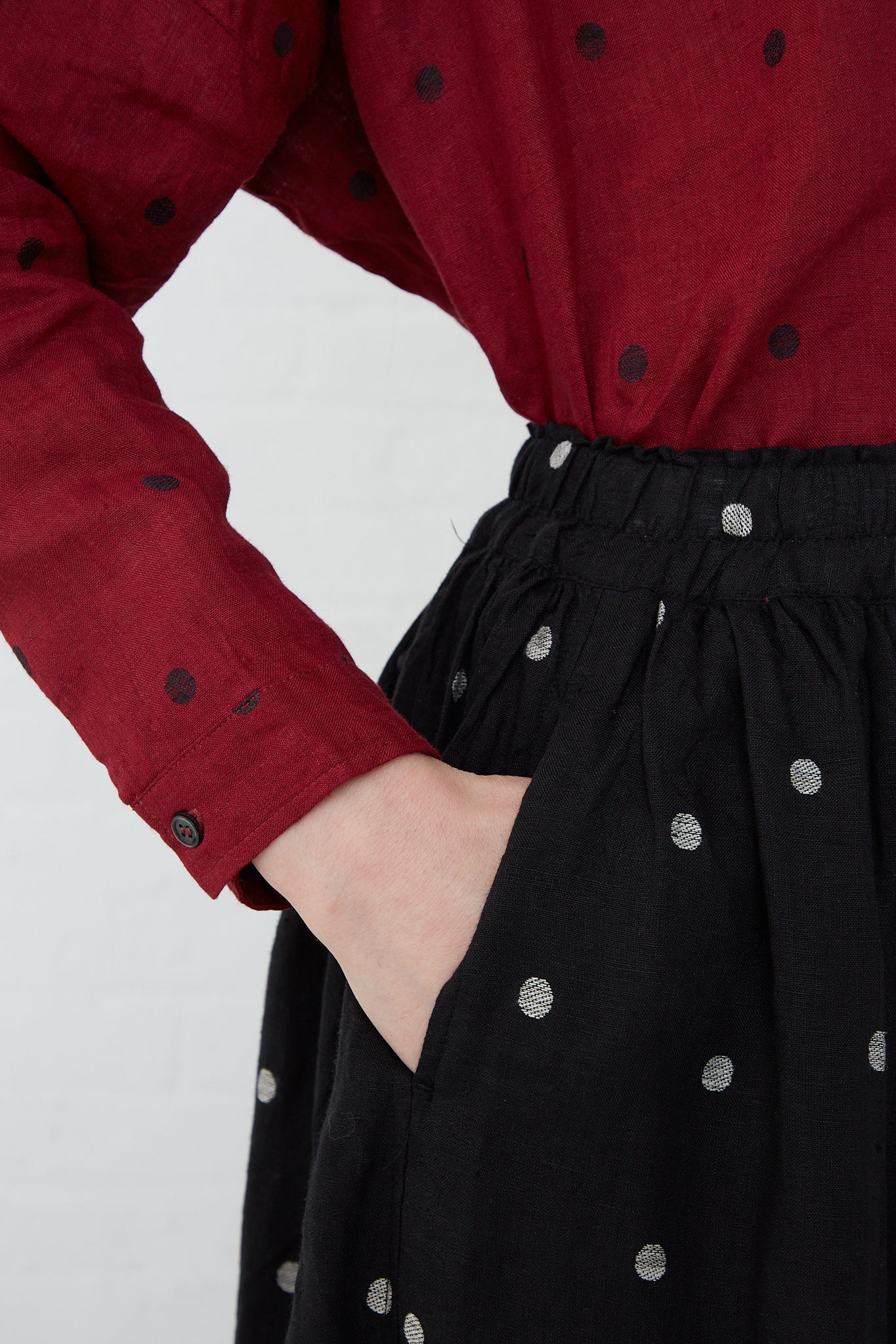 A woman wearing a black and natural Linen Dot Skirt by Ichi Antiquités.