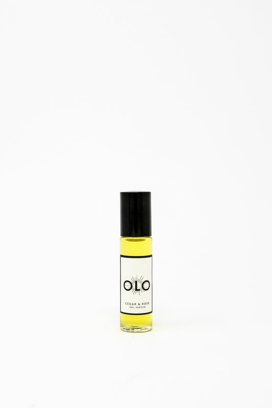A 9ml OLO perfume bottle labeled "Cedar & Rose" displayed on a plain white background.