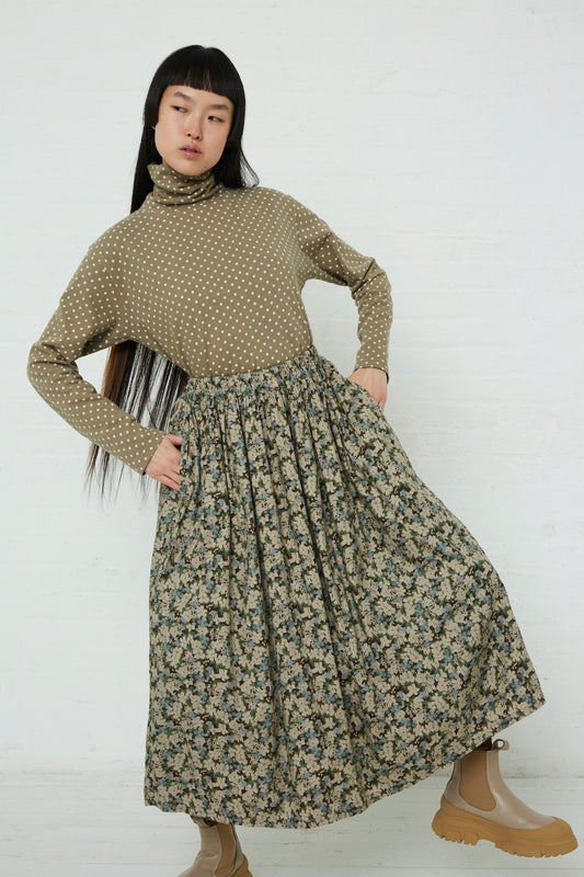A woman wearing a Floral Skirt in Brown by Ichi with an elasticated waistband.