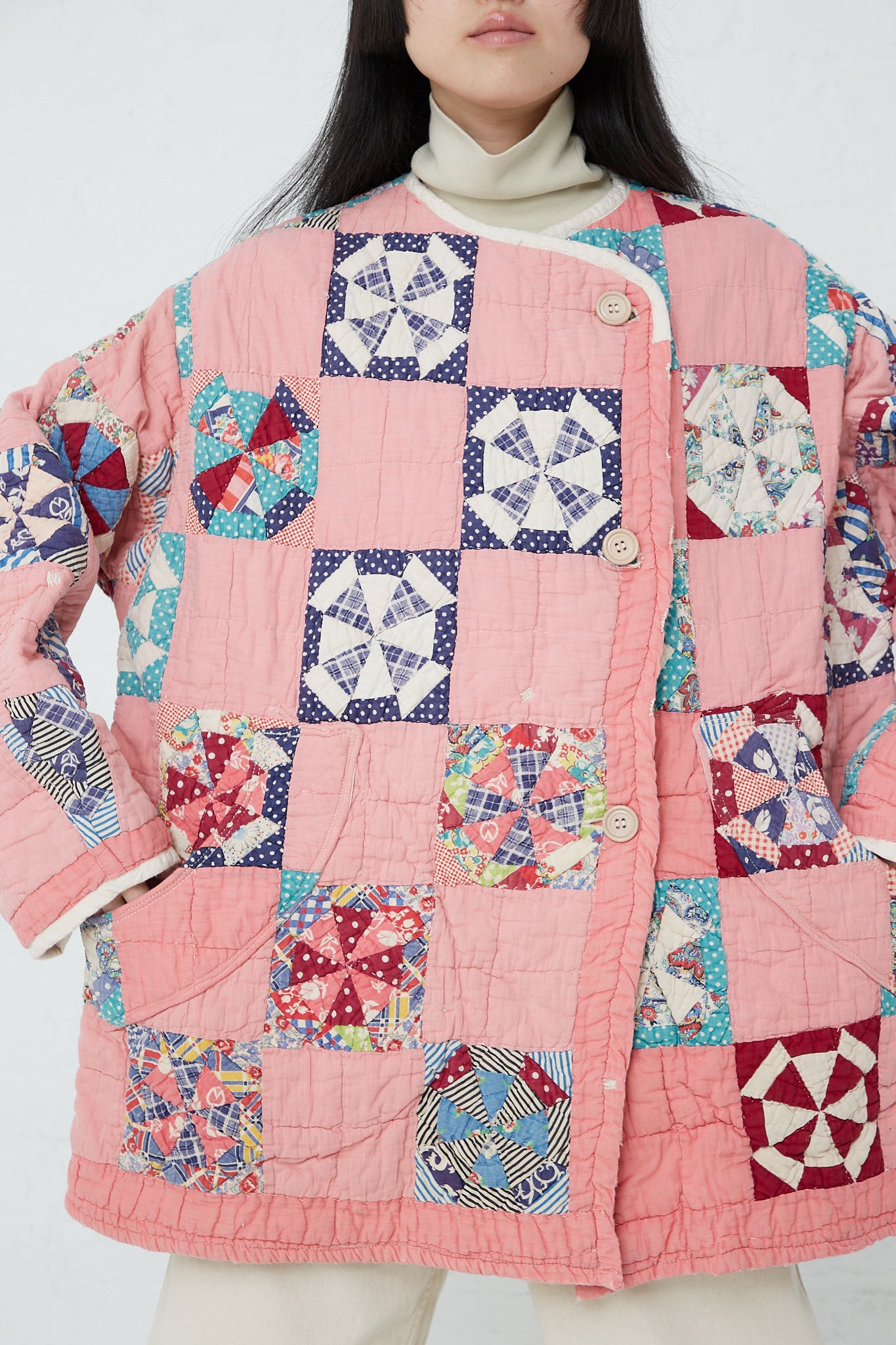 A woman wearing an As Ever Quilt Jacket in Pink.