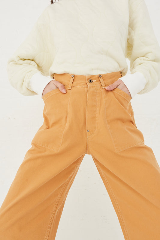 CHIMALA Cotton Canvas Work Pant in Apricot - Oroboro Store | Front view and up-close. Model's hands on both hips.