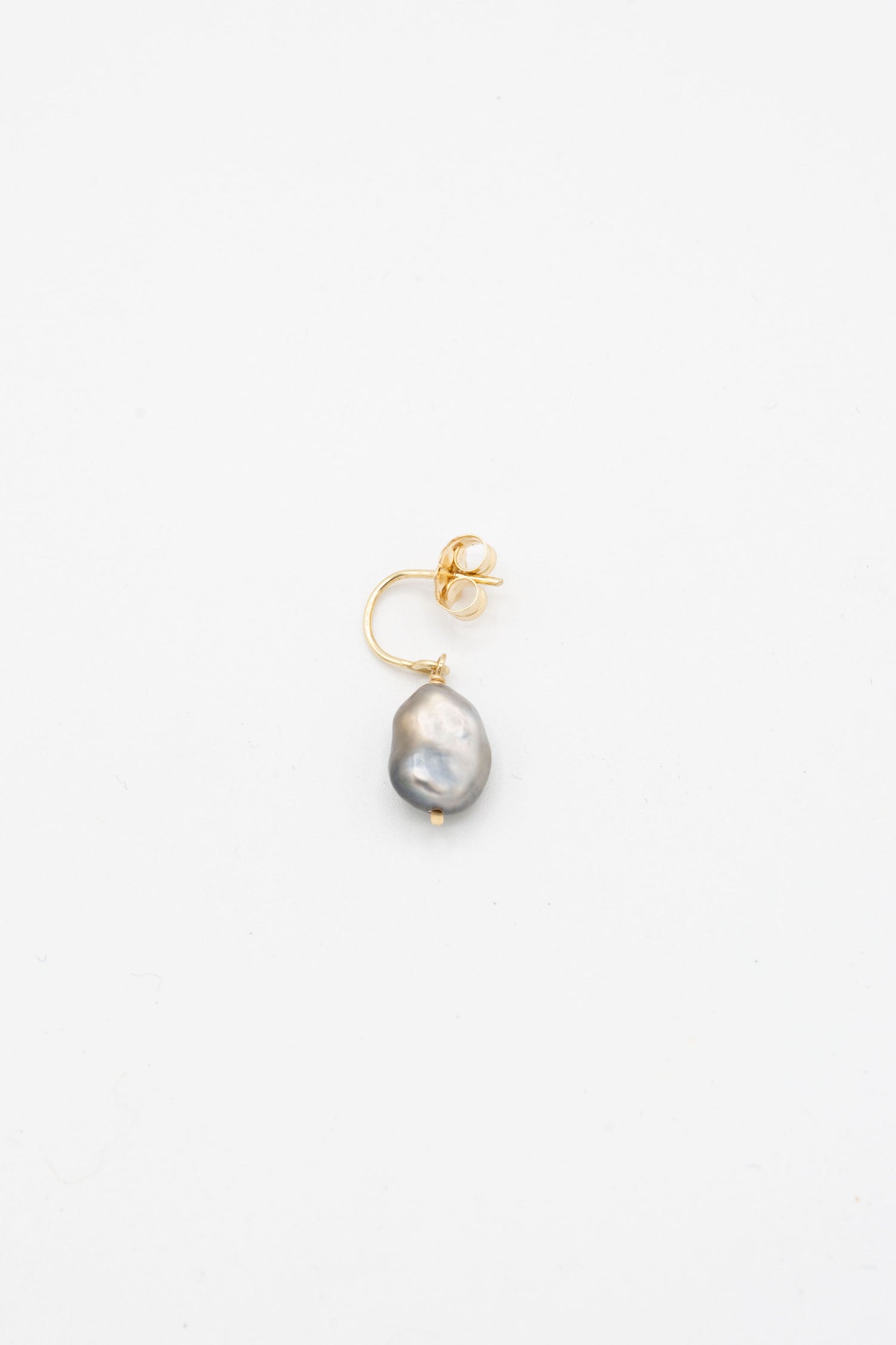 A 14K Crescent Charm Earring in Grey Keshi Pearl by Mary MacGill against a white background.
