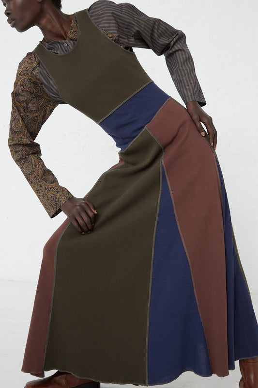 A model in a SC103 Cotton Rib Crest Dress in Silt maxi dress made of cotton.