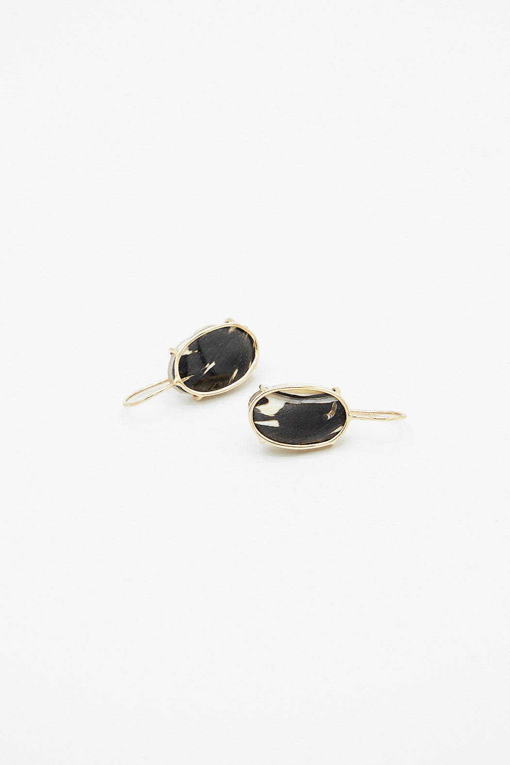 Handmade 14K Floating Drop Earrings in Cowrie Shell by Mary MacGill on a white background.