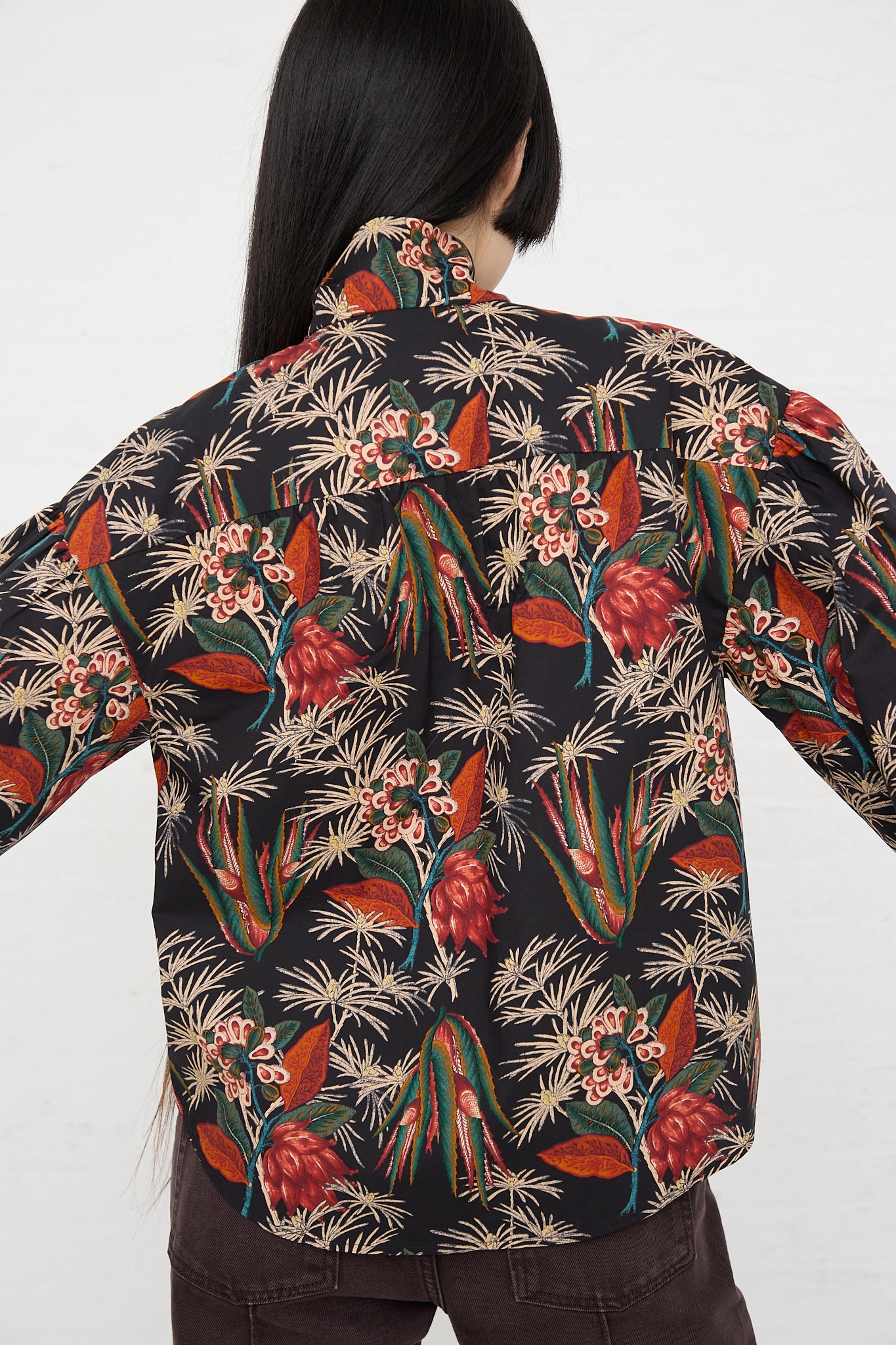 Back view of a model wearing the Ulla Johnson Alberta Blouse in Anthurium print.