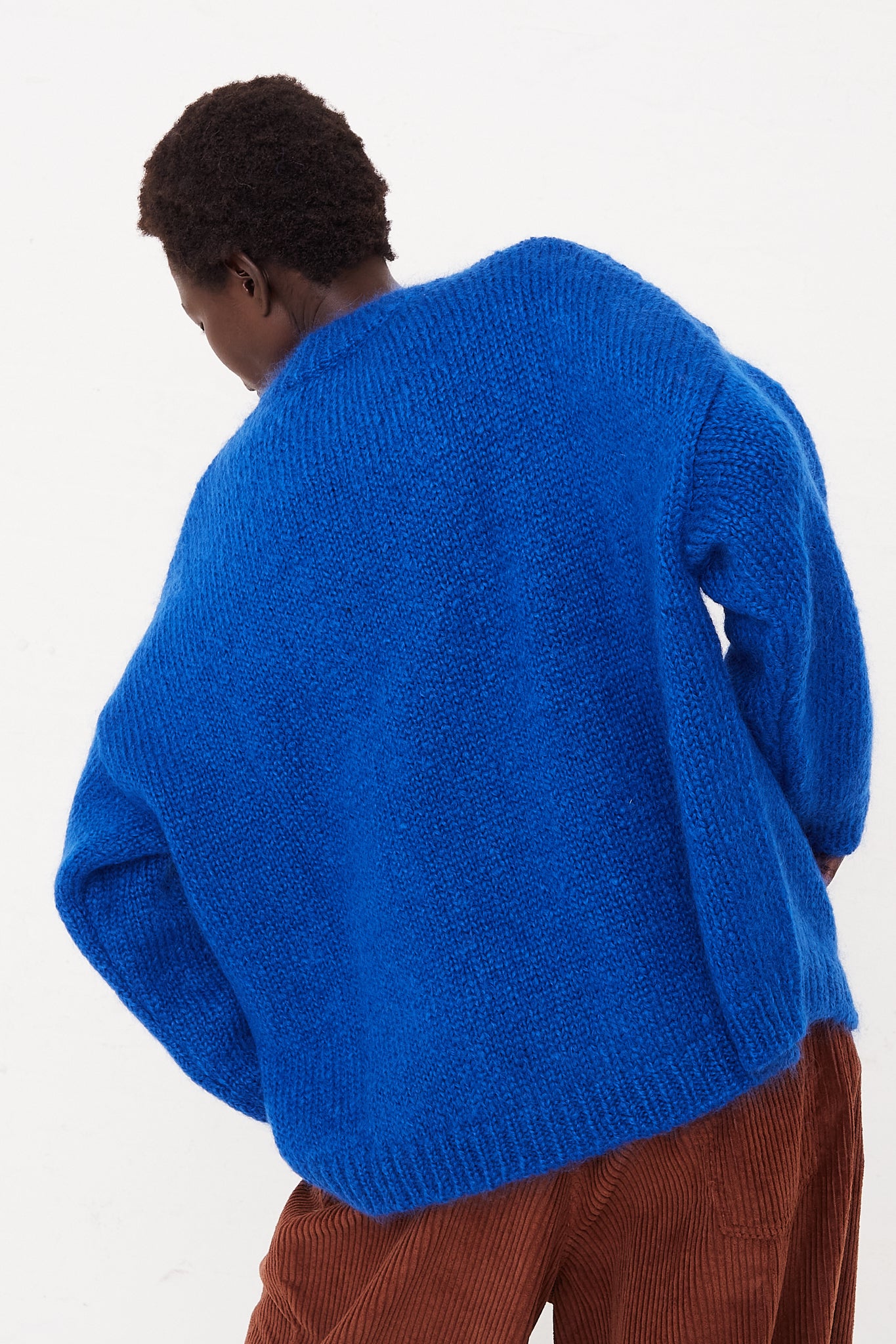 CORDERA Mohair Sweater in Blue | Oroboro Store | Back view of sweater upclose on model
