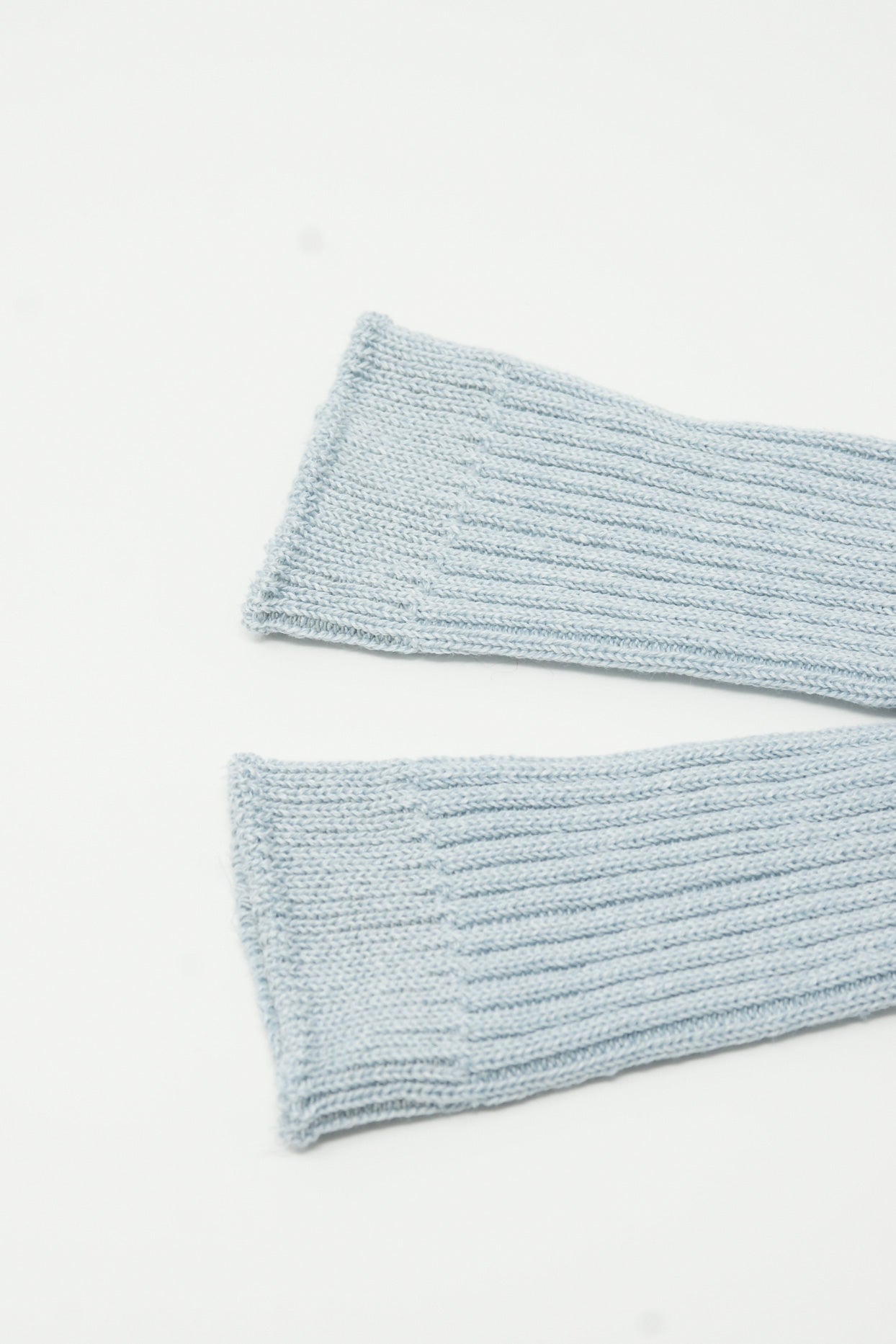 A pair of Linen Rib Socks in Light Blue by Ichi Antiquités on a white surface.
