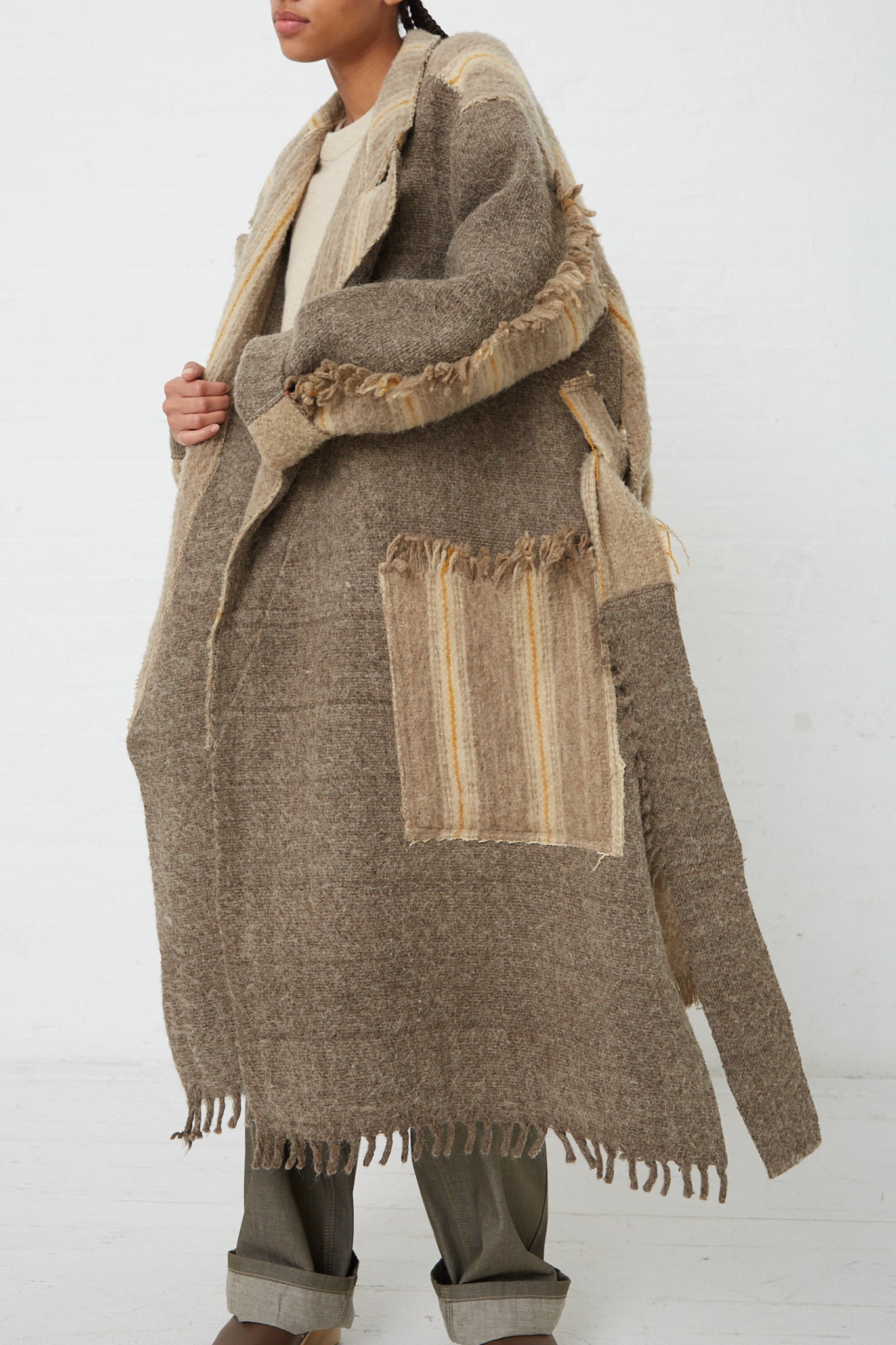 A woman wearing a Thank You Have A Good Day Wool Blanket Swing Trench.