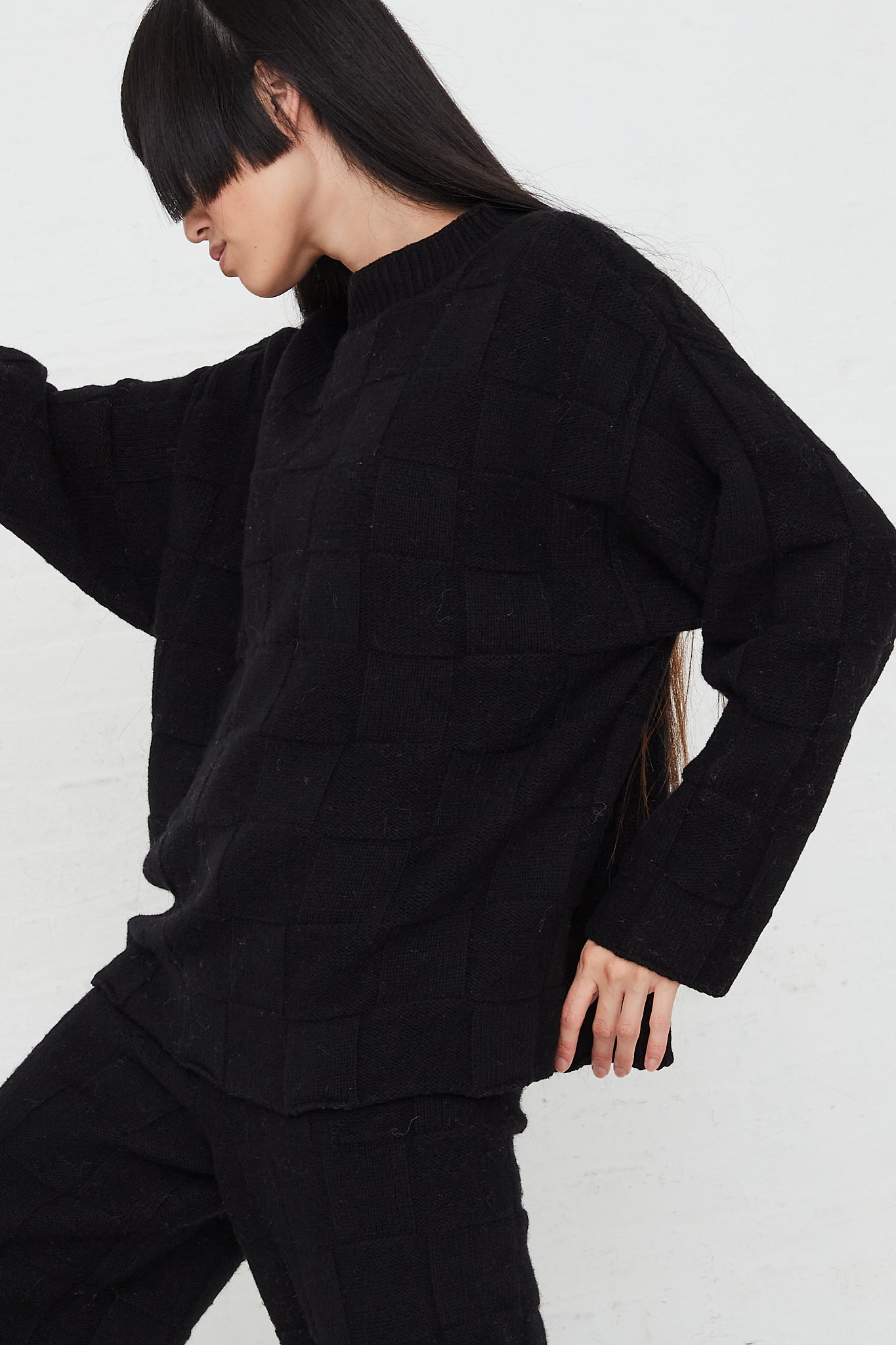 Konak Knit Sweater in Black by Baserange for Oroboro Front Sideview