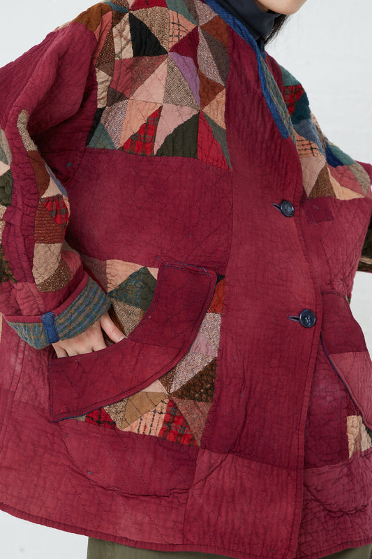 A woman wearing an oversized fit, red As Ever Quilt Jacket in Mulberry. Available at Oroboro Store.