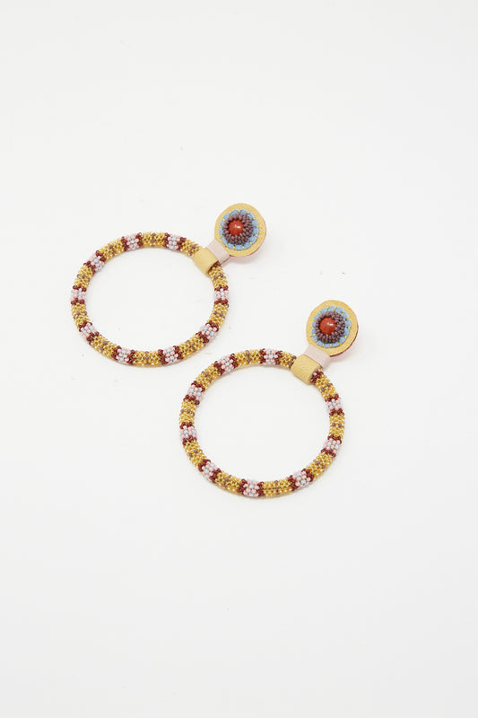 A pair of Large Beaded Hoops in Red Jasper Stones by Robin Mollicone with red and blue beads.
