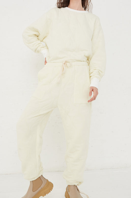 CHIMALA Quilted Drawstring Pant in Ivory - Oroboro Store | Full length view. Hand on hip.