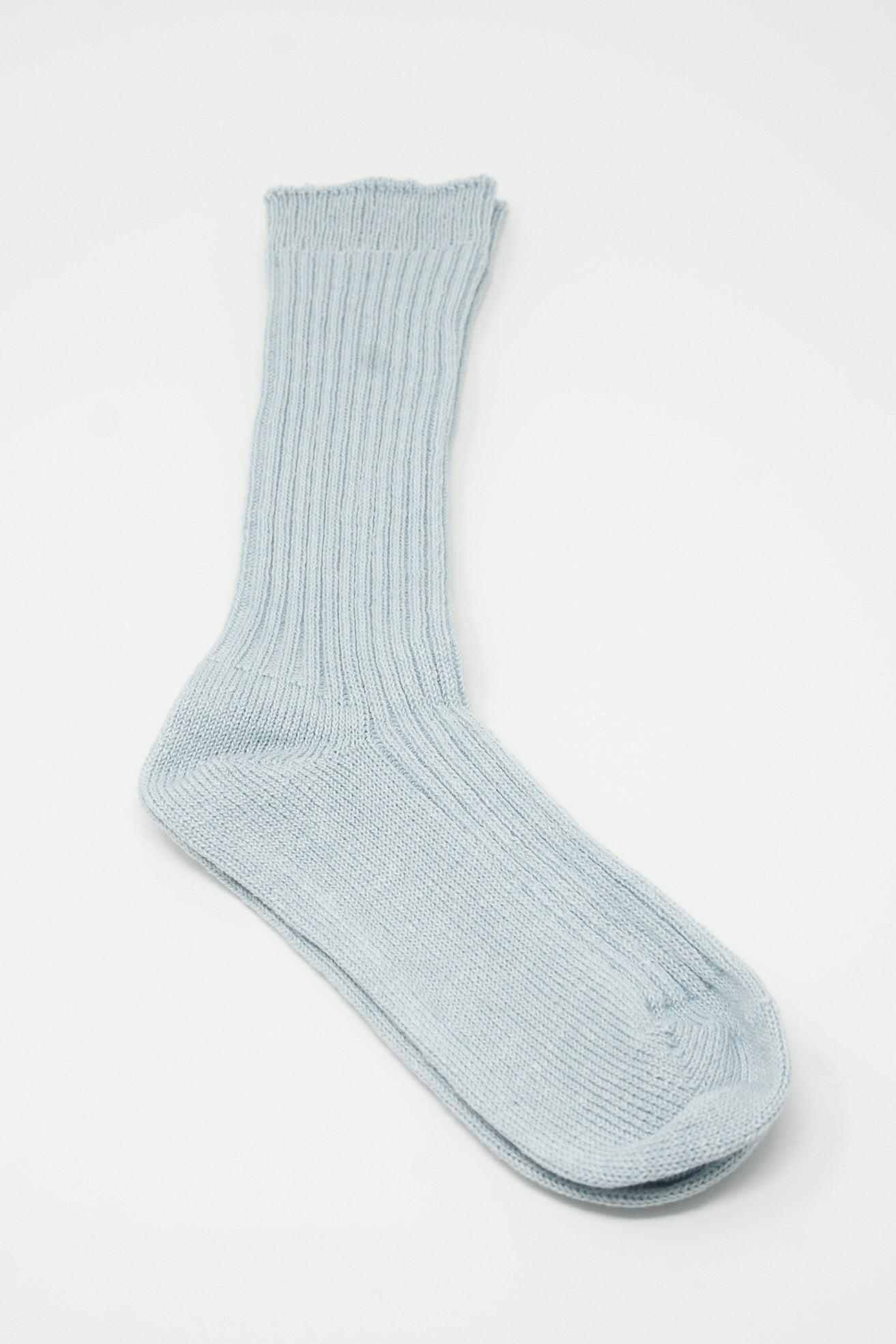 A pair of Linen Rib Socks in Light Blue by Ichi Antiquités on a white surface.
