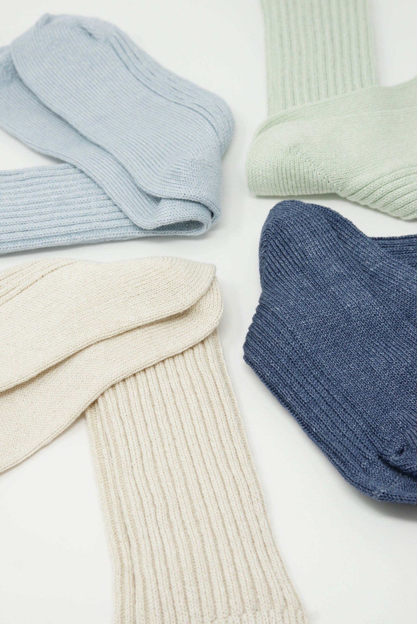 Four pairs of Linen Rib Socks in Blue by Ichi Antiquités on a white surface. Available at Oroboro Store.