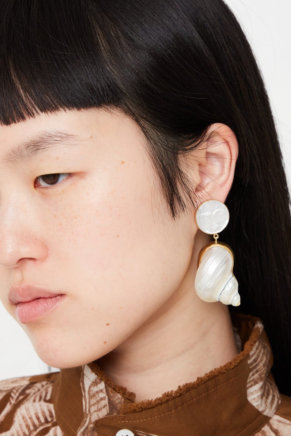 Grainne Morton - Moon and Star Shell Drop Earrings in Ivory full front view on model. 