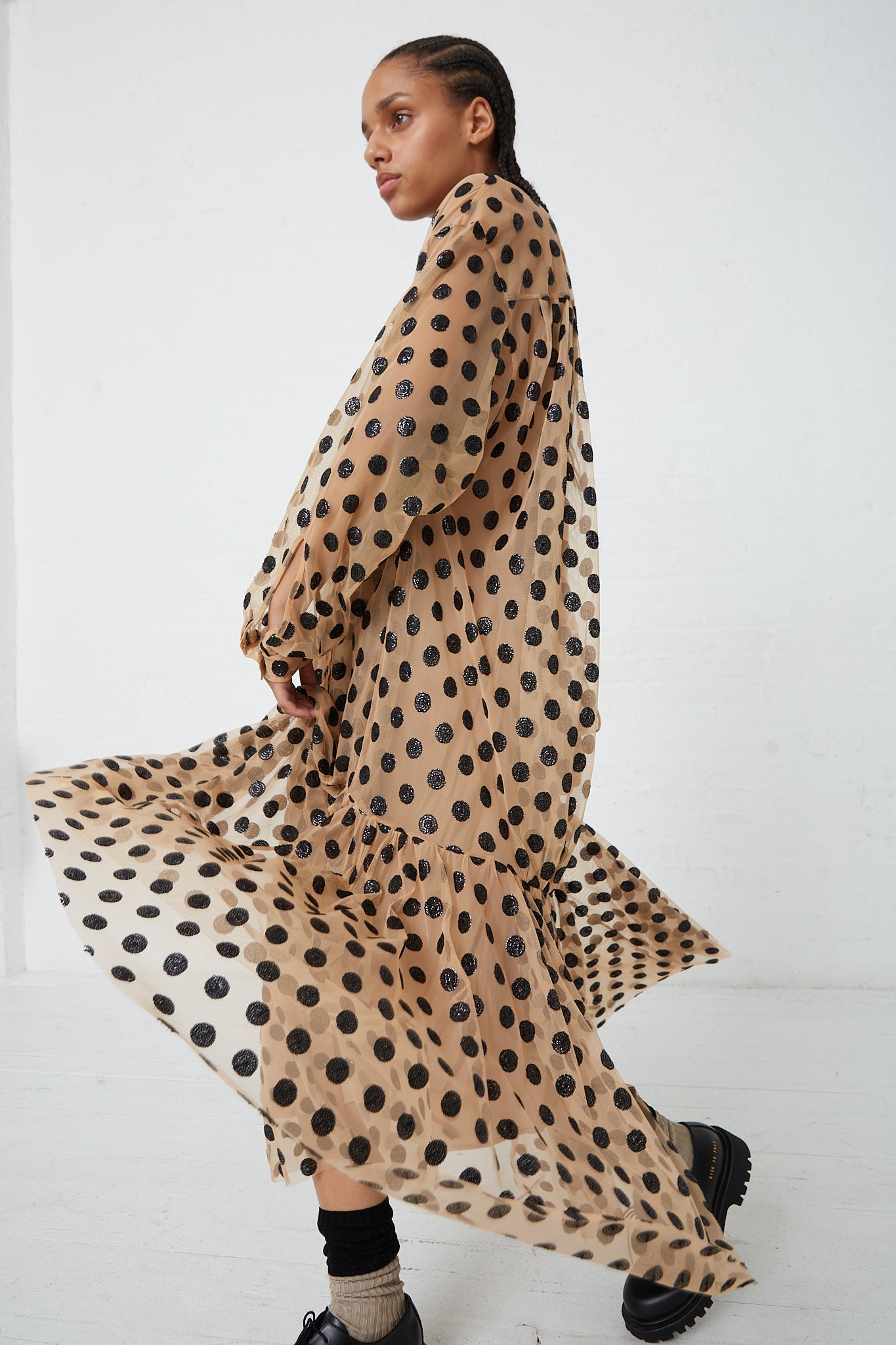 The model is wearing the Rachel Comey Sequin Dots Tulle Lanza Dress in Nude. Side view.