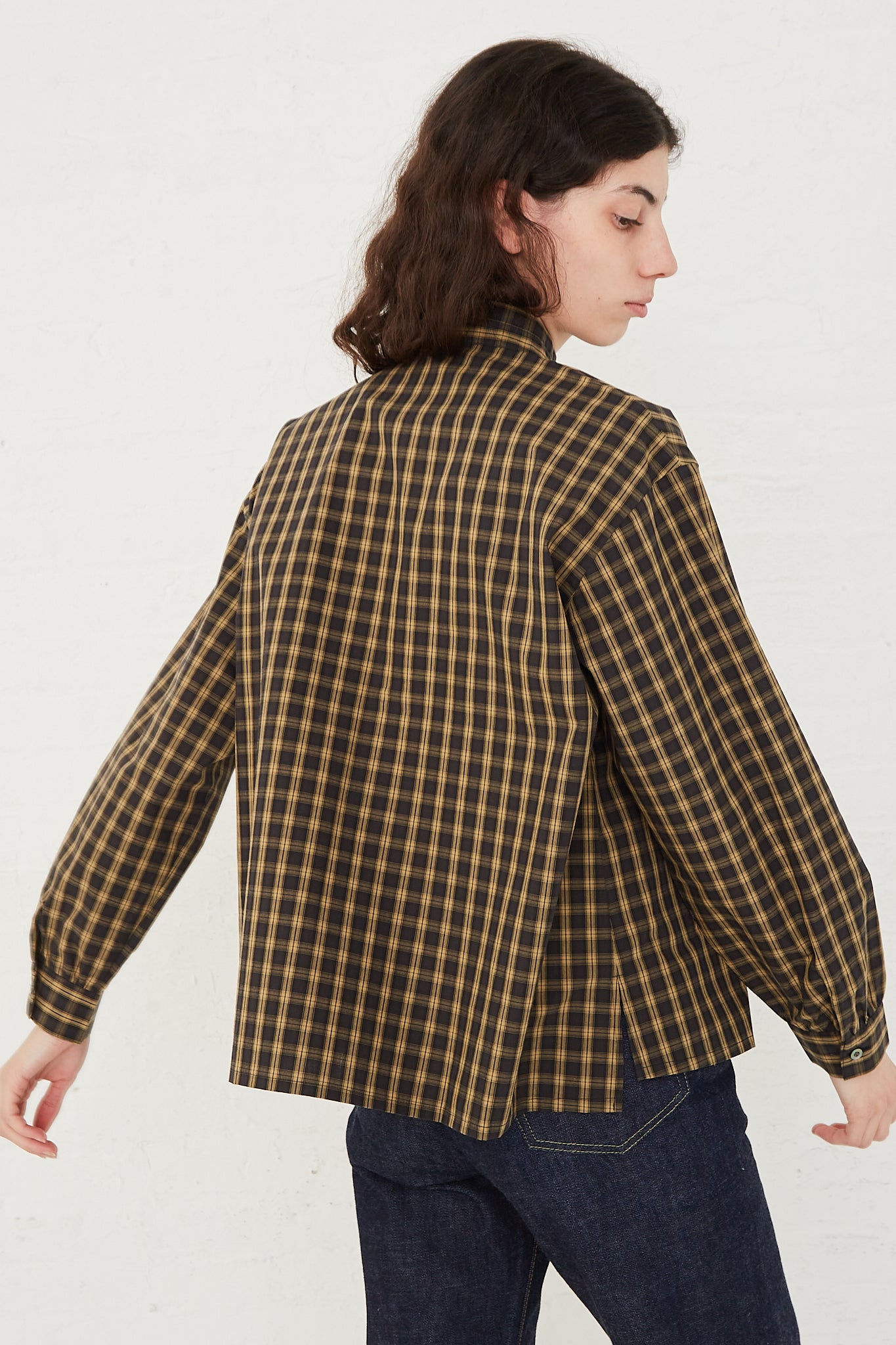CHIMALA Pleated Stand Collar Shirt in Yellow Check - Oroboro Store | Back view and full length. Model's arms raised to the side. 