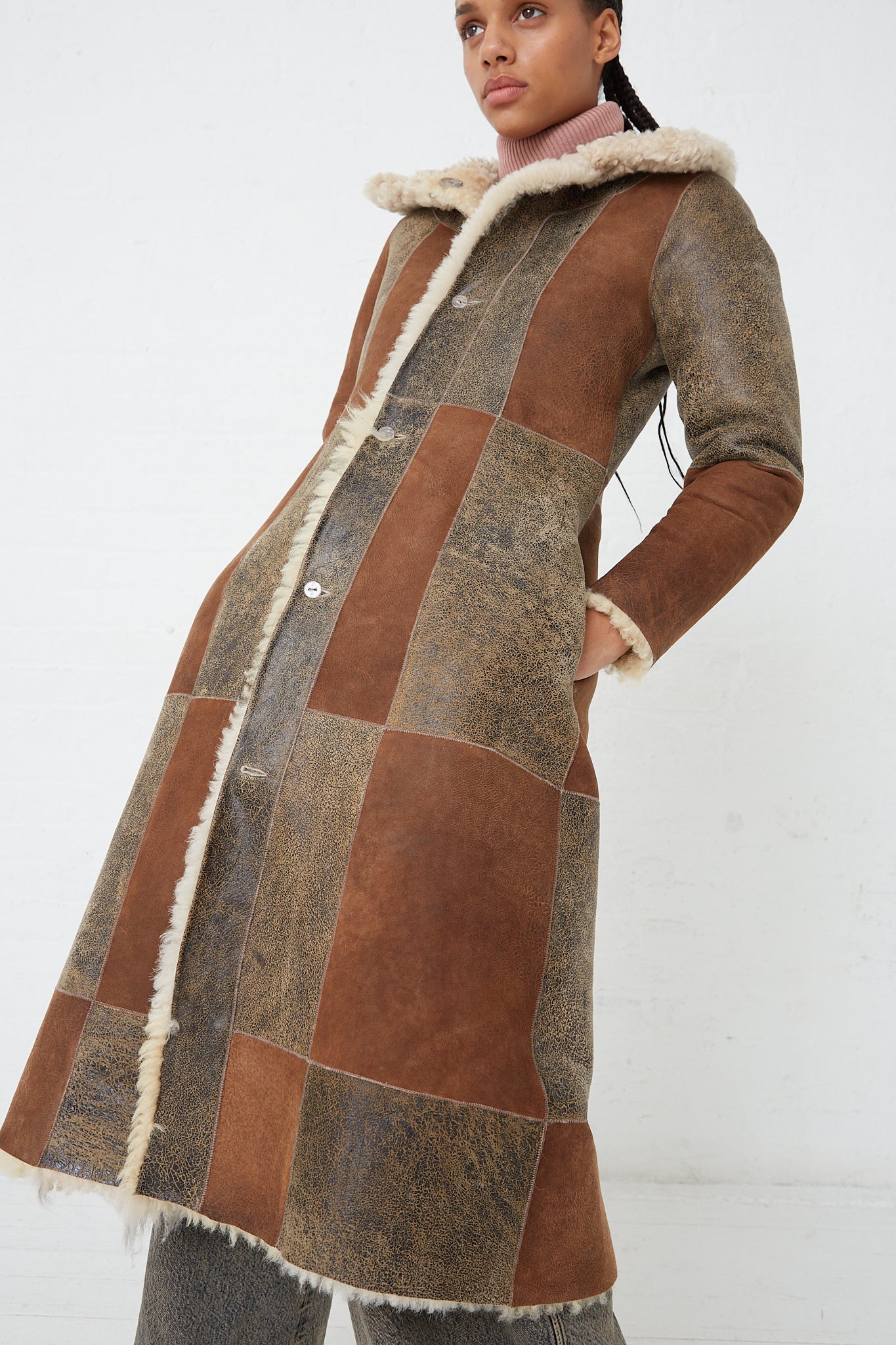 A woman wearing a Milena Silvano Sheepskin Albizia Coat in Tonal.  Second side. Front view.