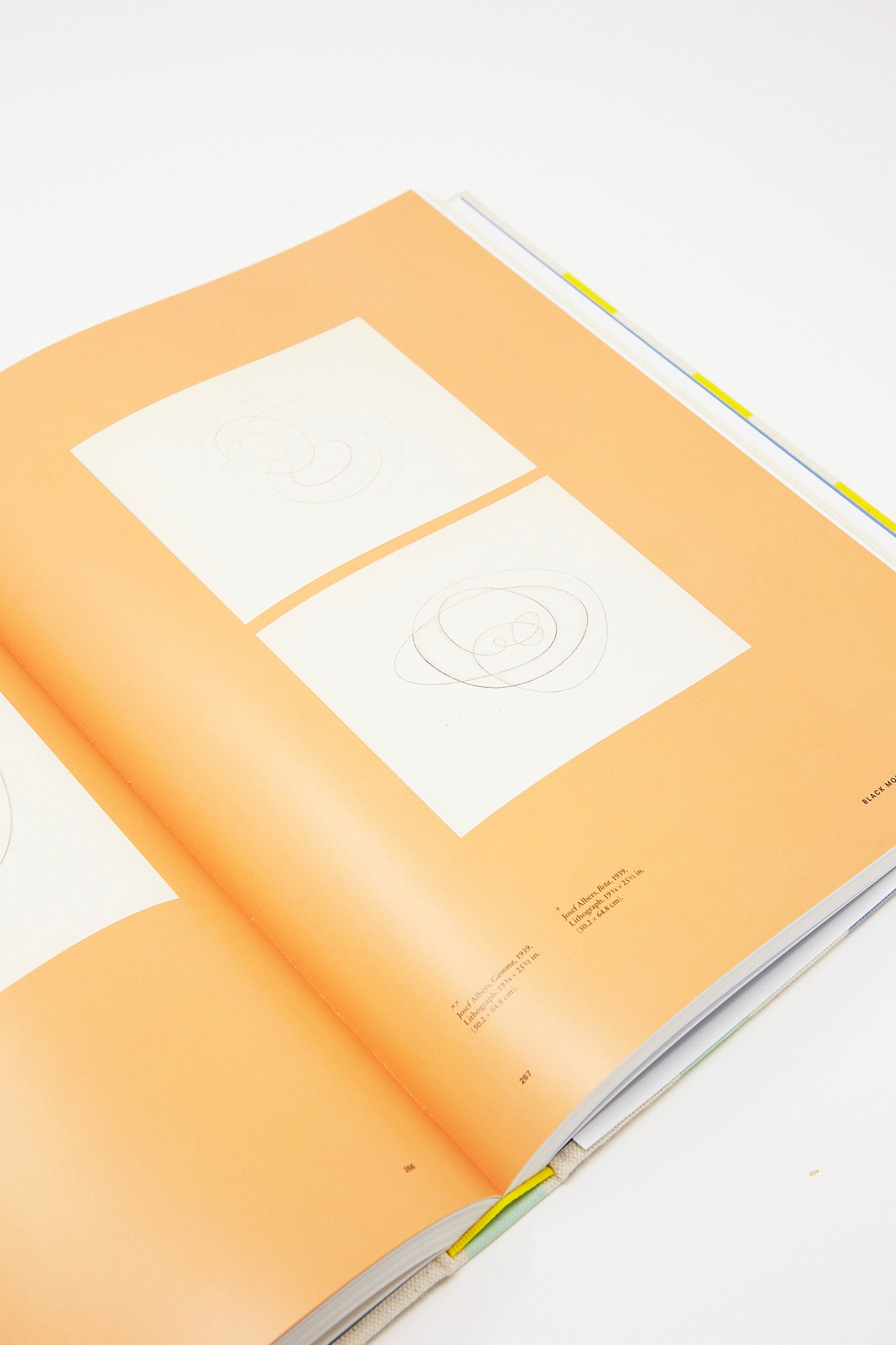 An open hardcover book with drawings by Anni & Josef Albers: Equal and Unequal, published by Phaidon.
