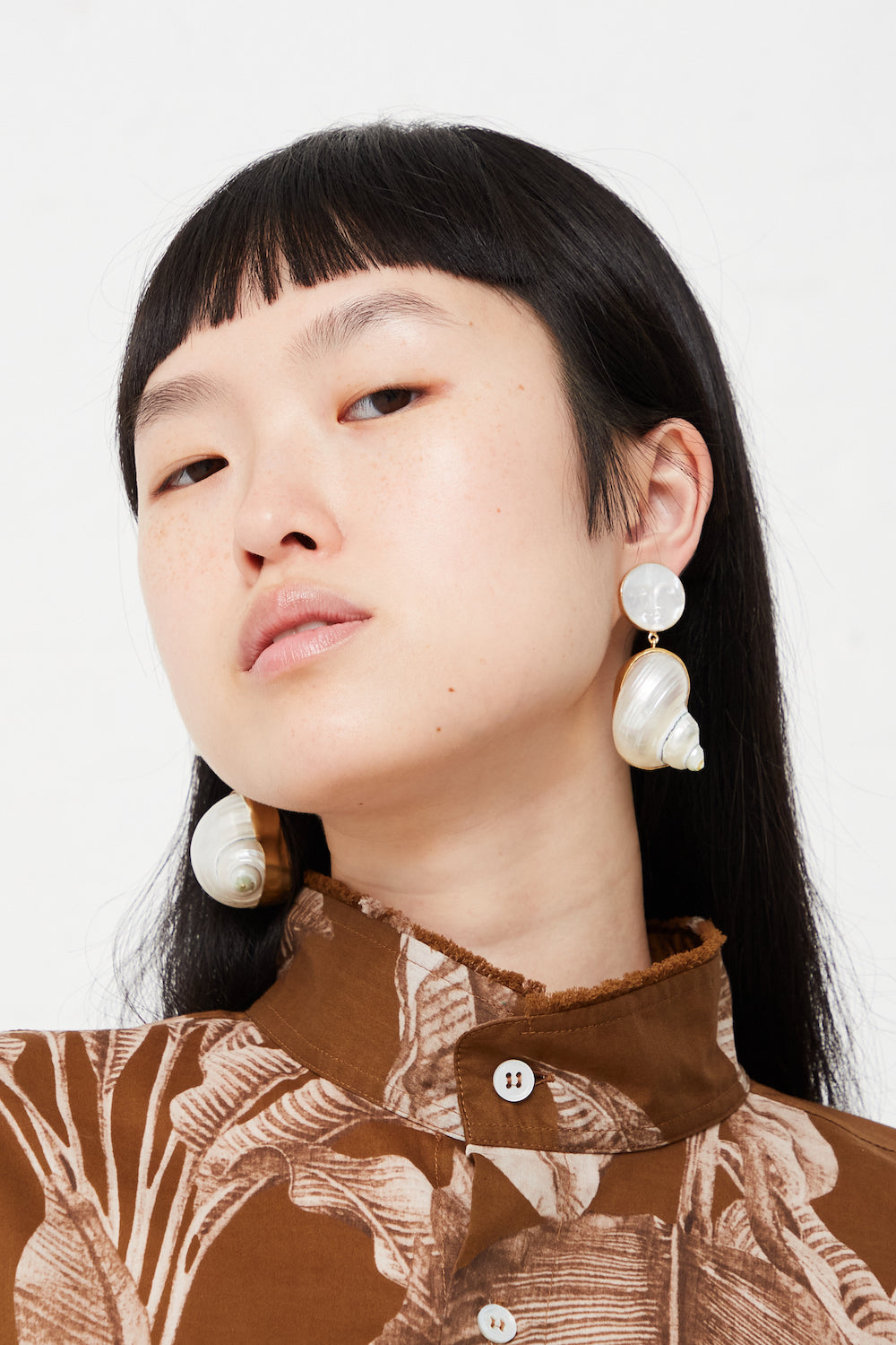 Grainne Morton - Moon and Star Shell Drop Earrings in Ivory full front view on model. 