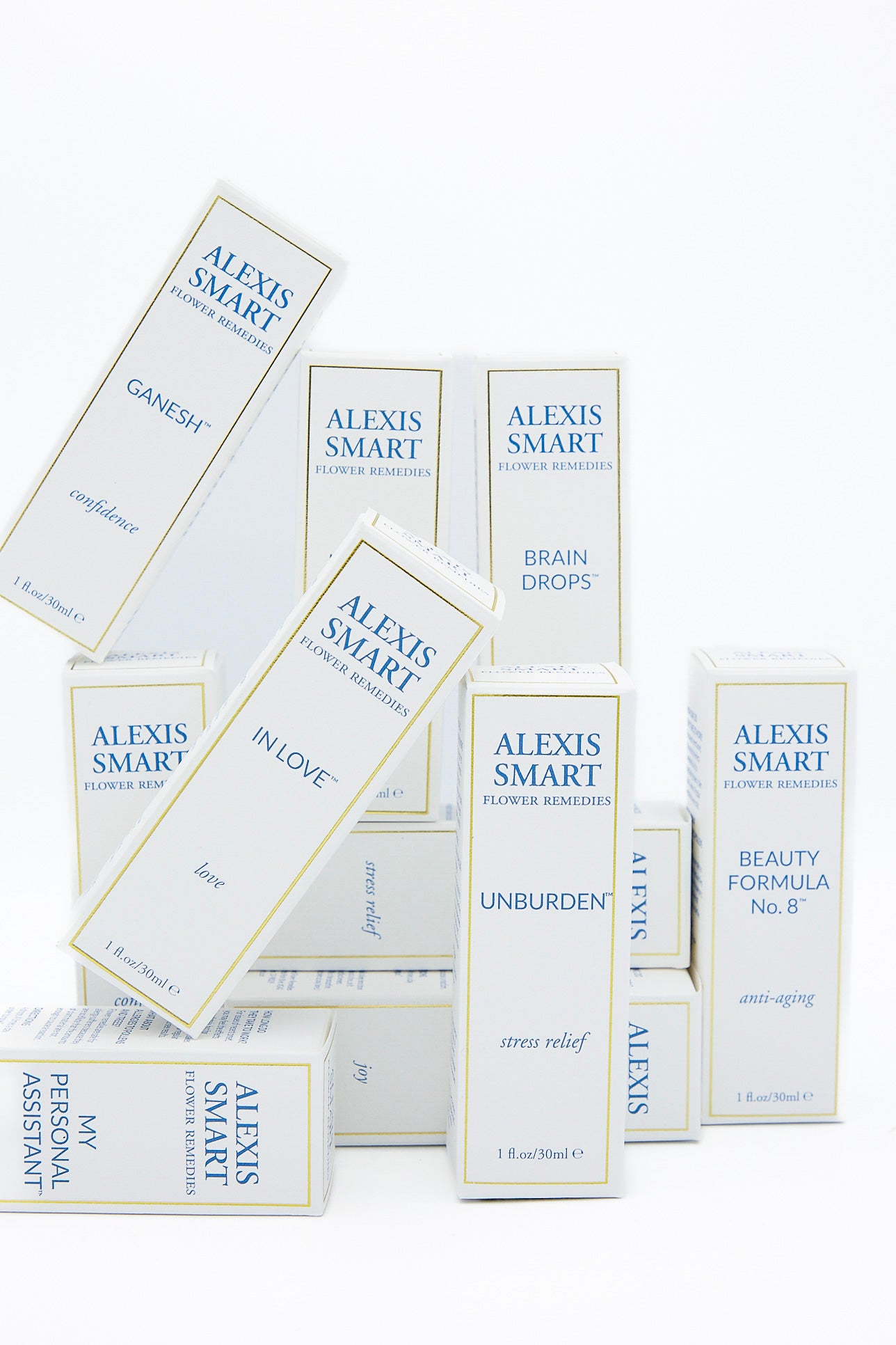 A stack of boxes showcasing Flower Remedies - In Love by Alexis Smart.