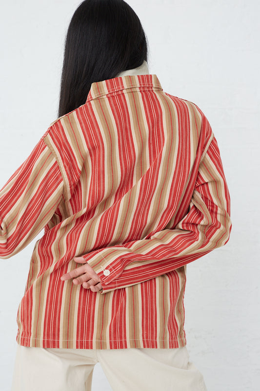 A woman wearing the As Ever Henri Jacket in Vintage Red Stripe. Back view.