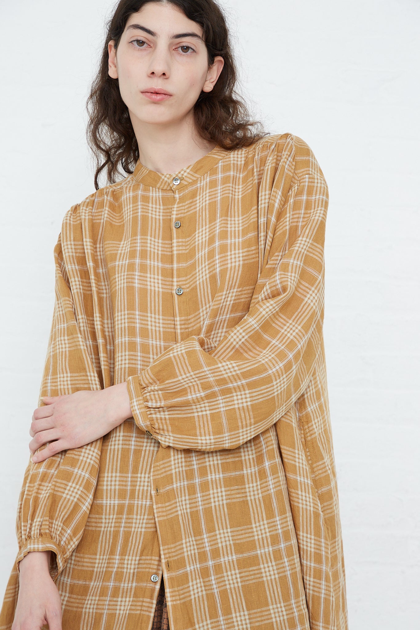 A model wearing a relaxed fit Linen Check Dress in Camel by Ichi Antiquités.