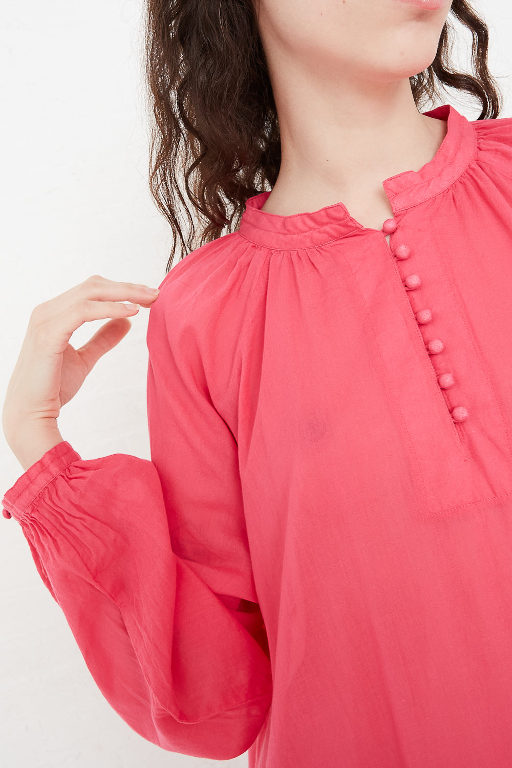 Dress in Pink sleeve and button placket detail