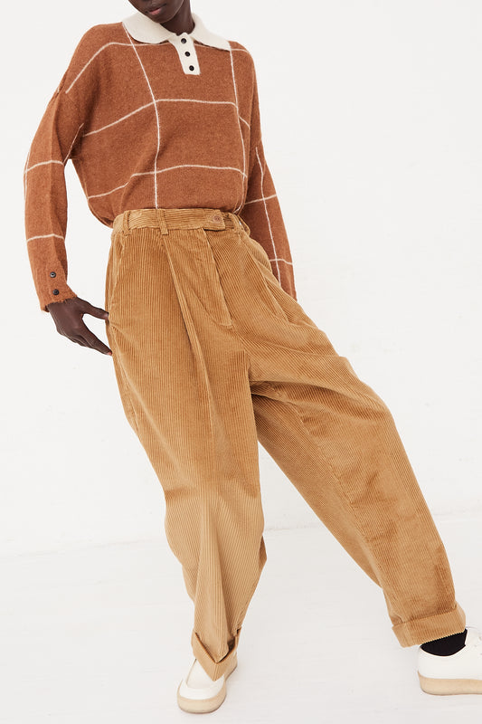 A man in Cordera's Masculine Pant in Miel.
