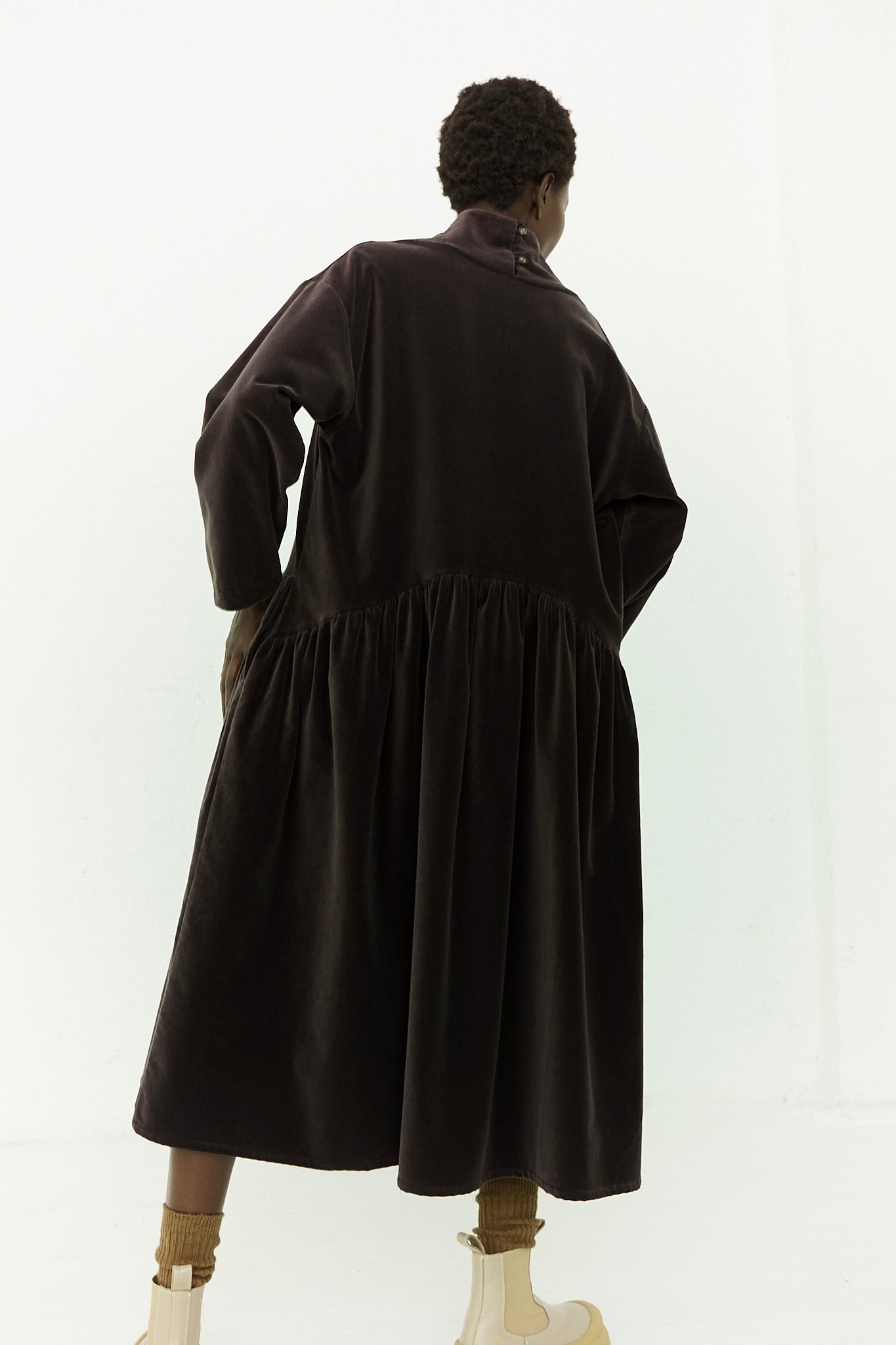 The back of a woman wearing a black velvet dress. Designed by Black Crane.