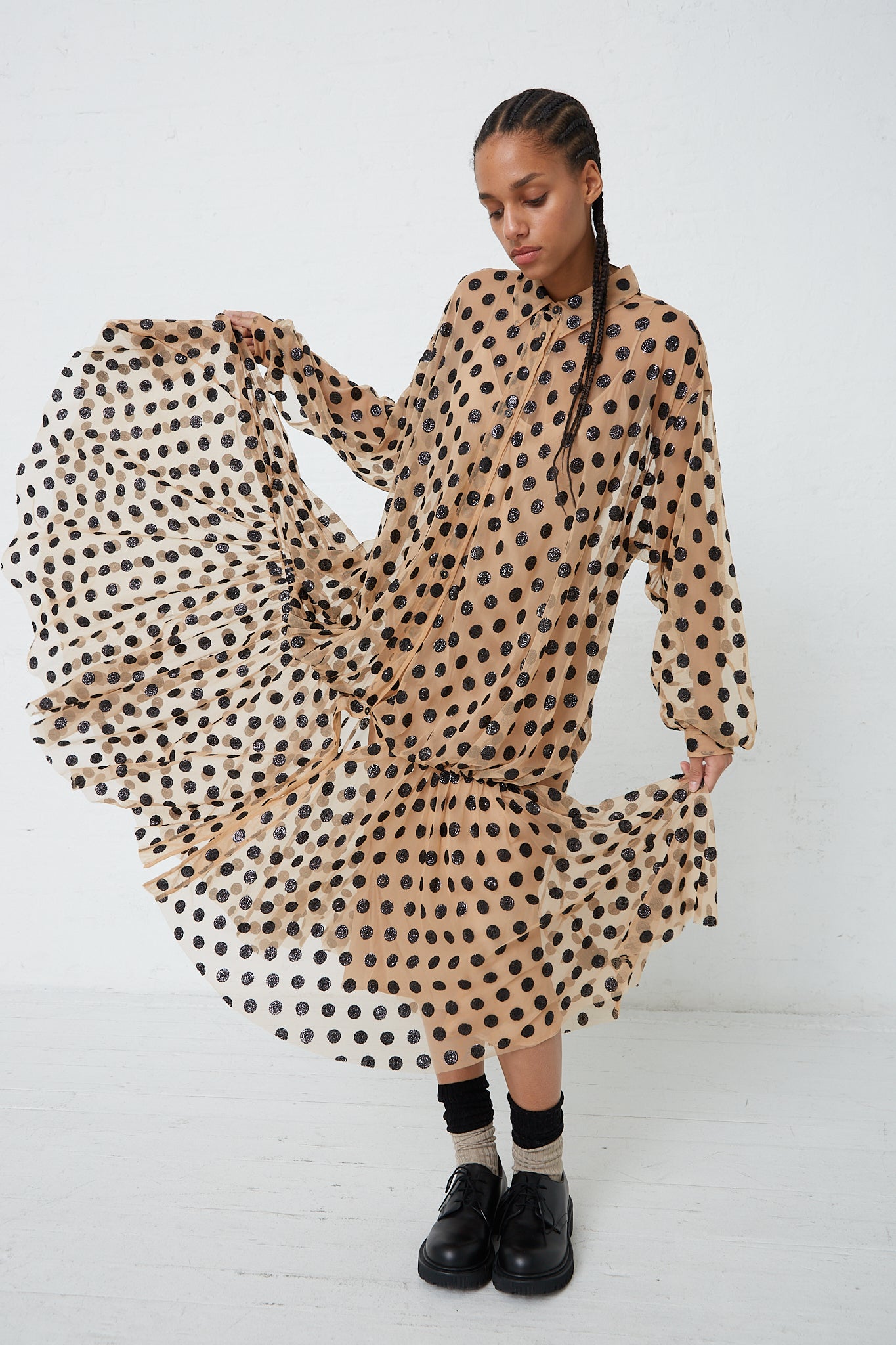 A woman wearing a Rachel Comey Sequin Dots Tulle Lanza Dress in Nude.