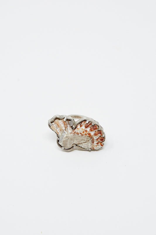 A unique La Ma r Sterling Silver Shell Ring 003 B with an orange and white bird on it.