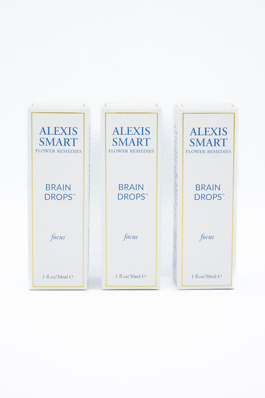 Three boxes of Alexis Smart Flower Remedies - Brain Drops designed to enhance attention and focus, and improve memory, placed on a white background.