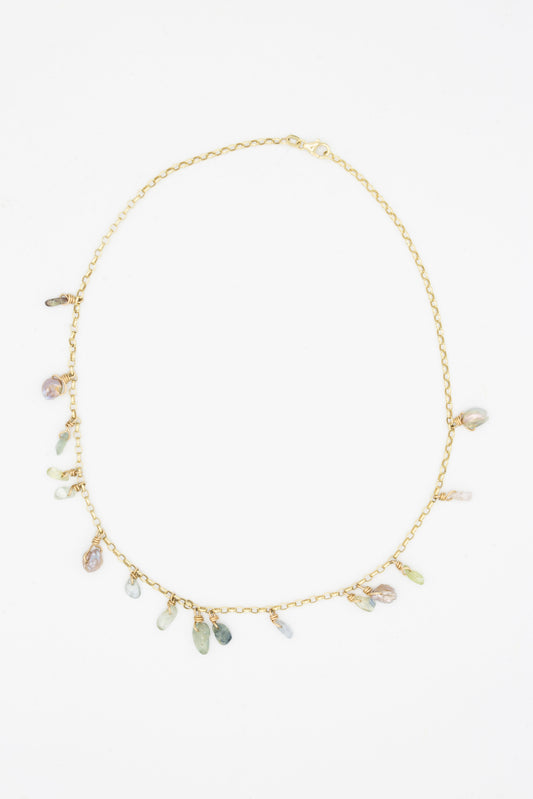 A Tara Turner Sapphire & Keshi Pearl Necklace with multi-colored stones and pearls.
