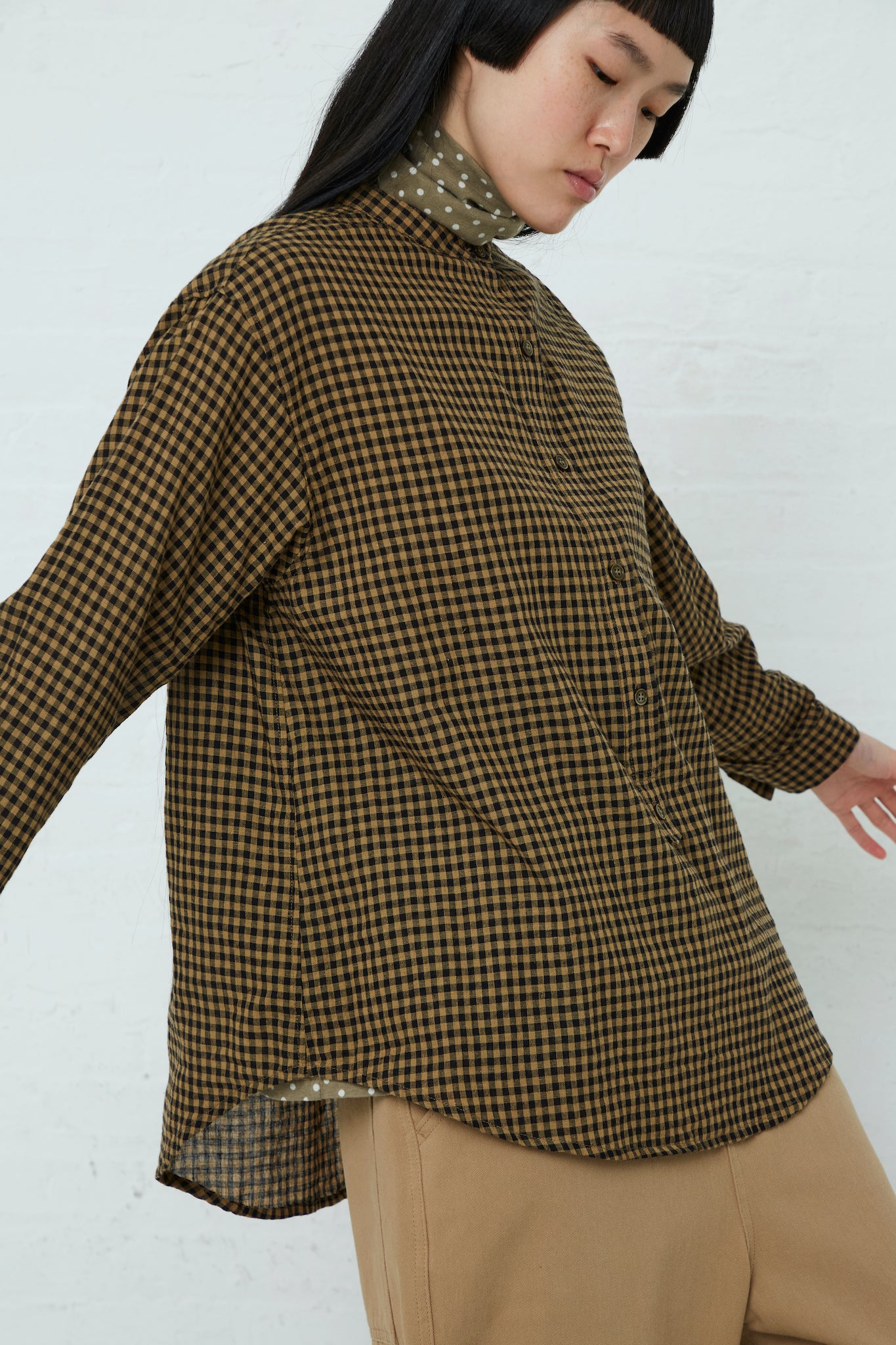 The model is wearing a relaxed fit Cotton/Linen Gingham Shirt in Beige by Ichi. Side view.