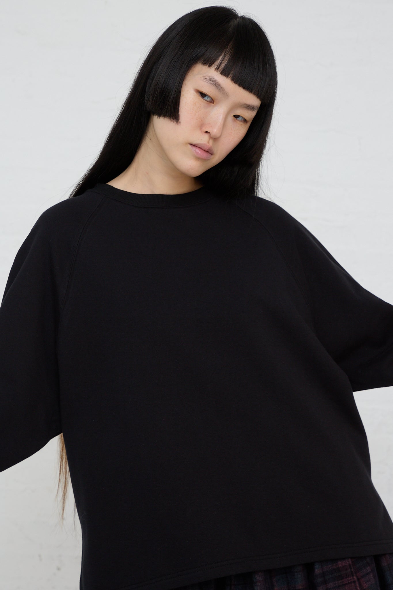 The model is wearing an Ichi Cotton Knit Pullover in Black. Front view.