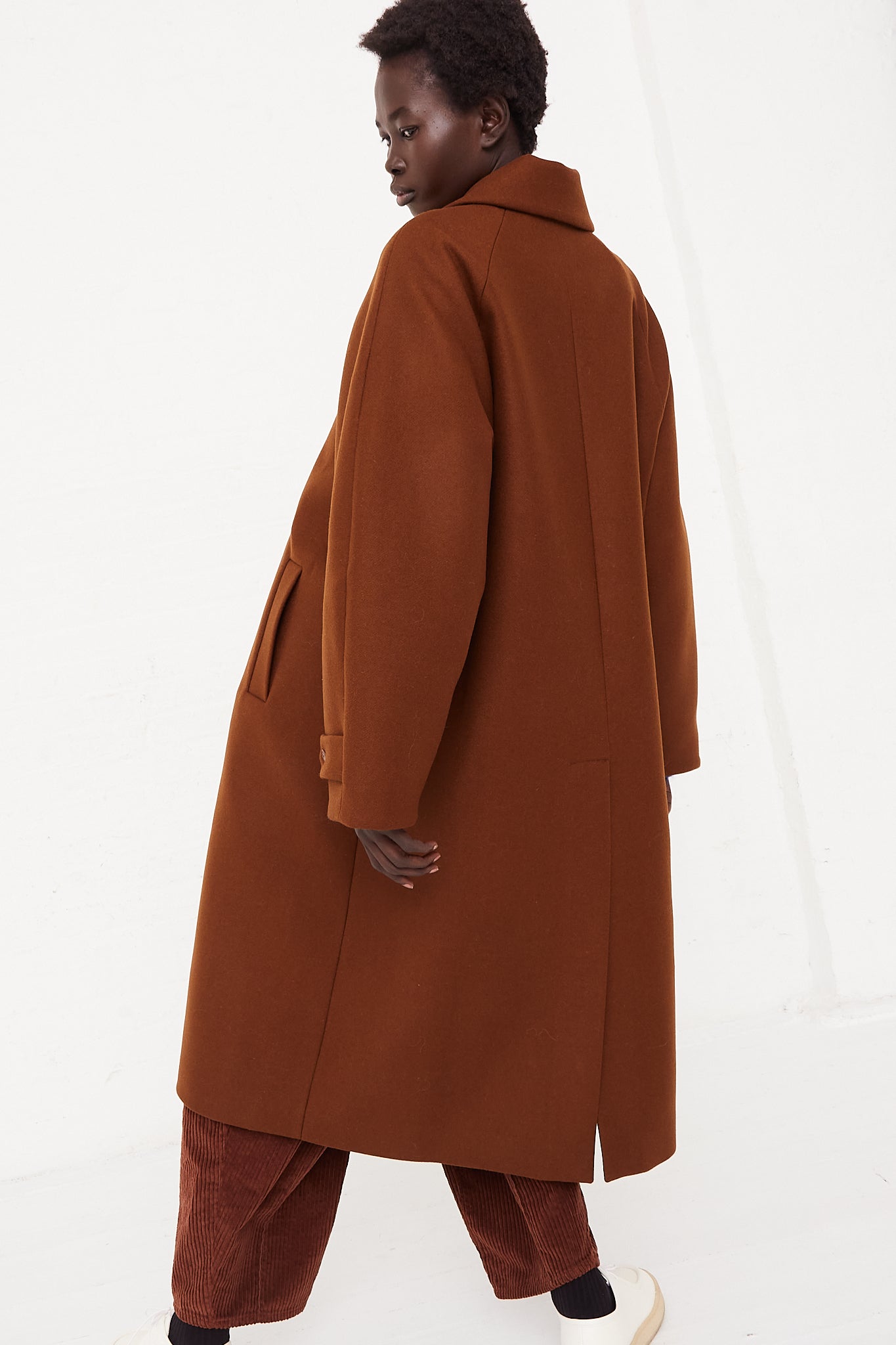 CORDERA Wool Coat Camel | Oroboro Store | Back image of coat full length view showing back of coat details on model