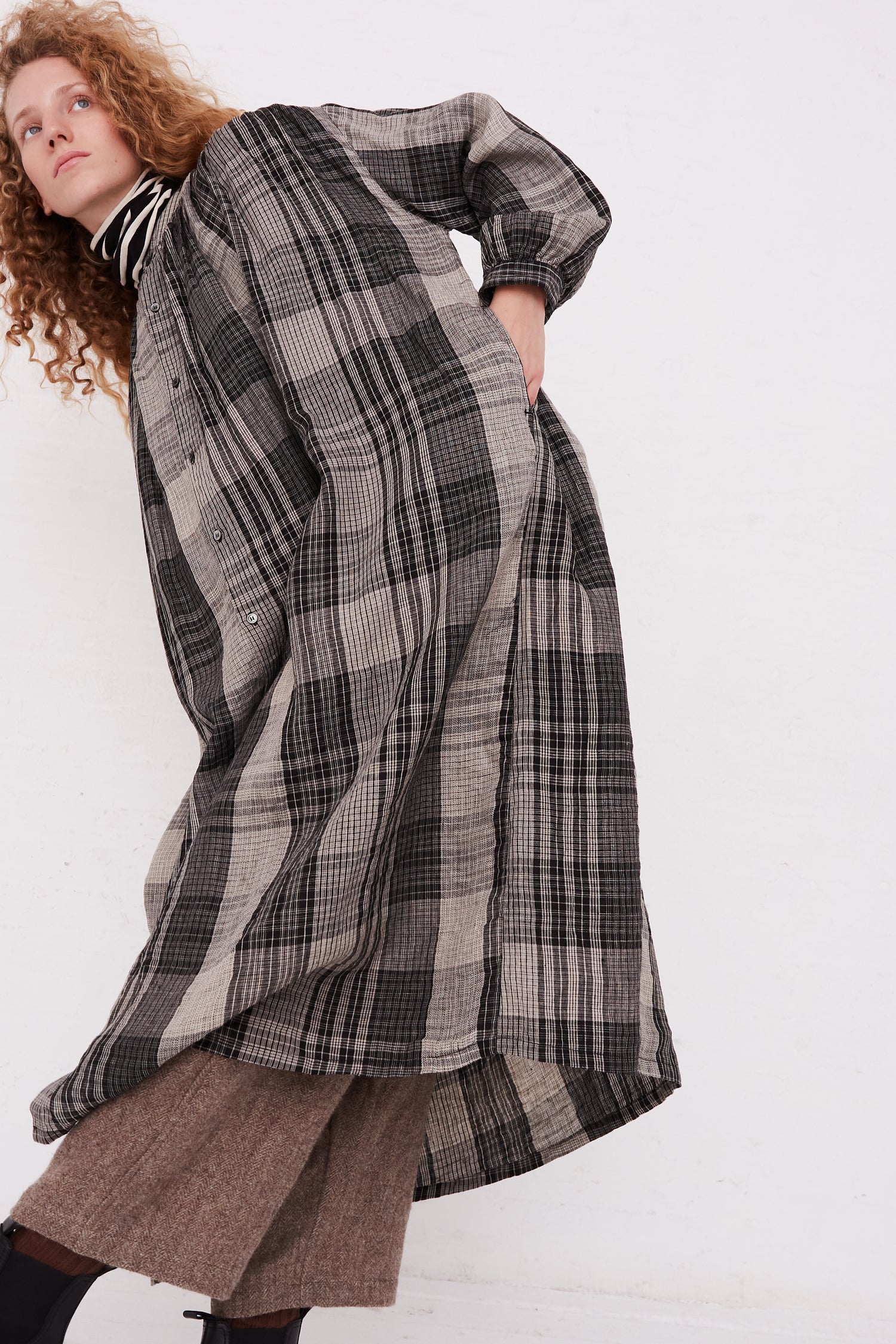 A model wearing the Ichi Antiquités Linen Big Check Dress in Black.