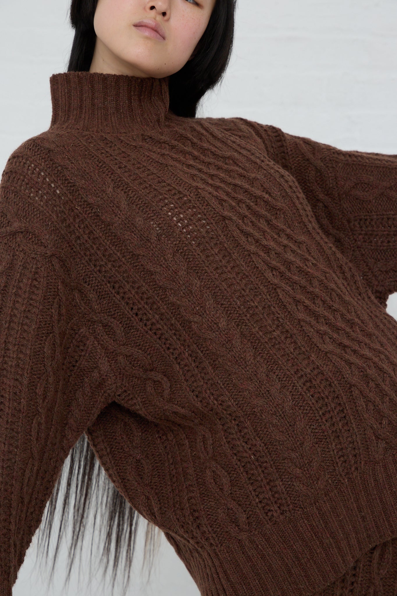 The model is wearing a Ichi Knit Turtleneck Pullover in Brown.