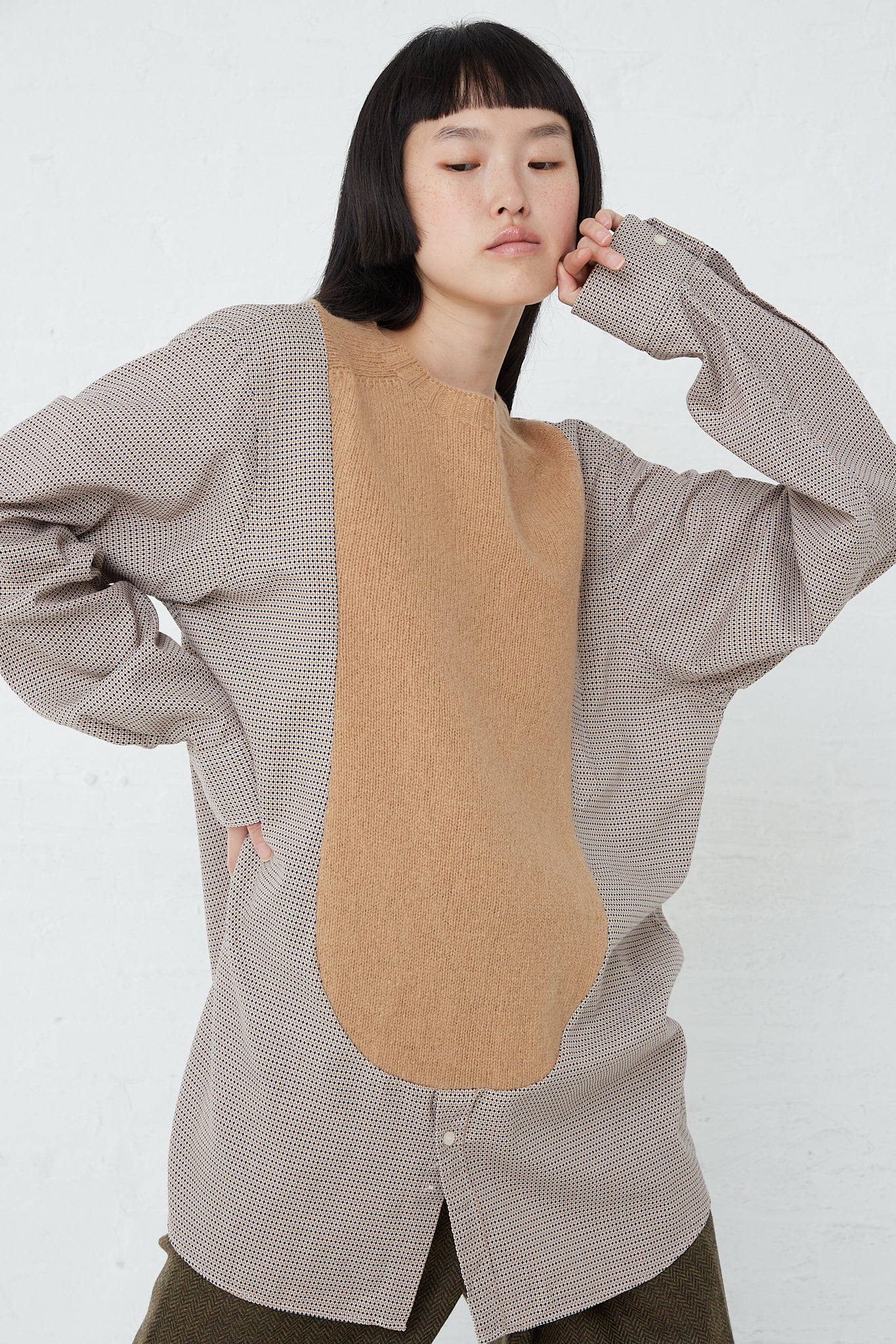 The model is wearing a Bless No.68 Front Insert Pullover in Beige Pattern with a tan patch.
