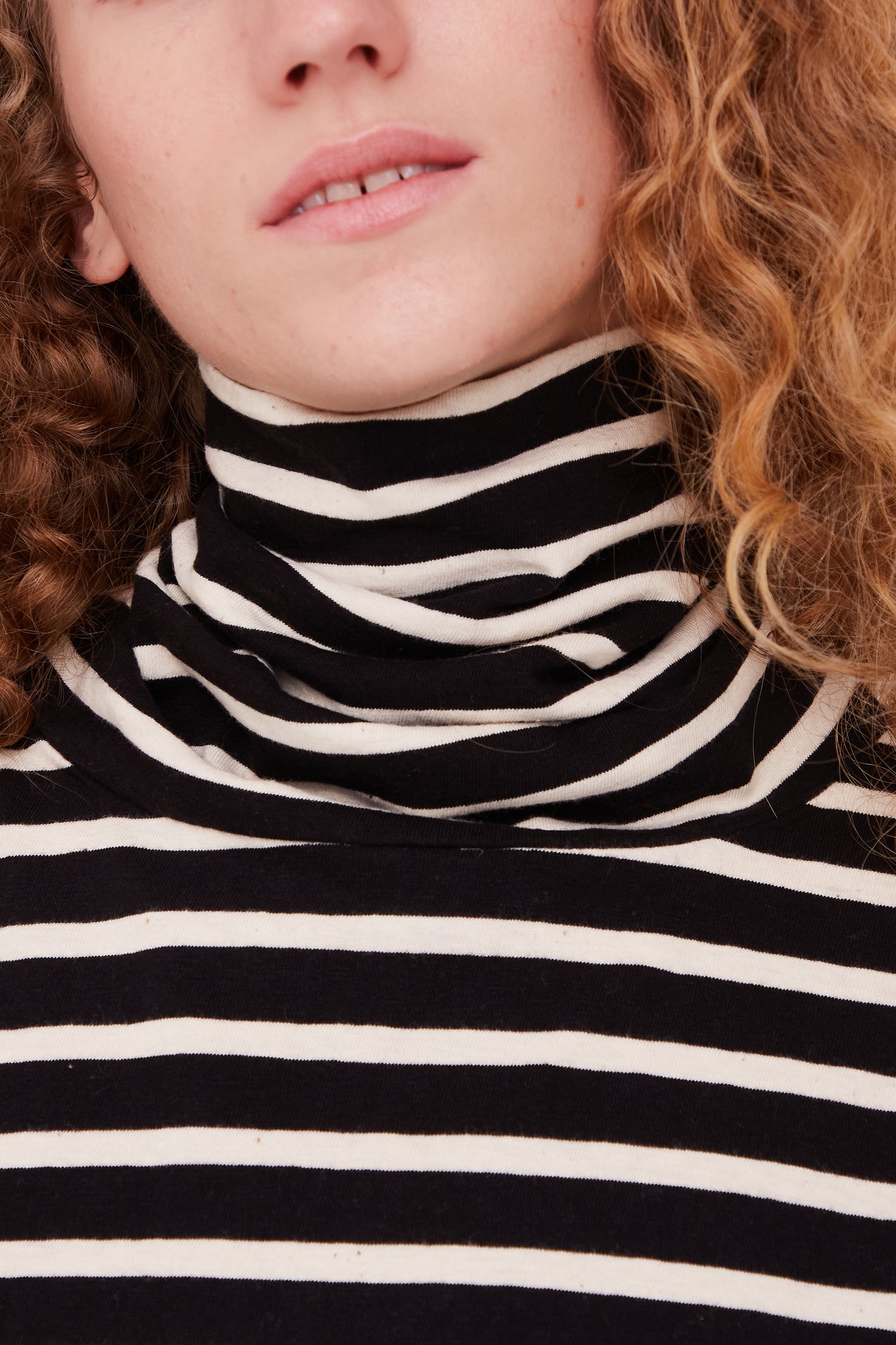 A model wearing a Cotton Turtleneck Pullover in Black and Natural by Ichi Antiquités.