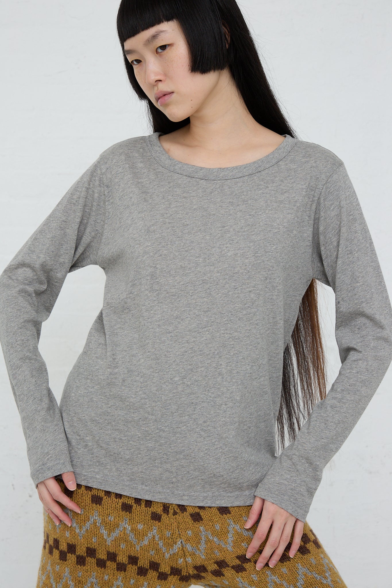 A woman wearing an Ichi Cotton Knit Pullover in Gray.