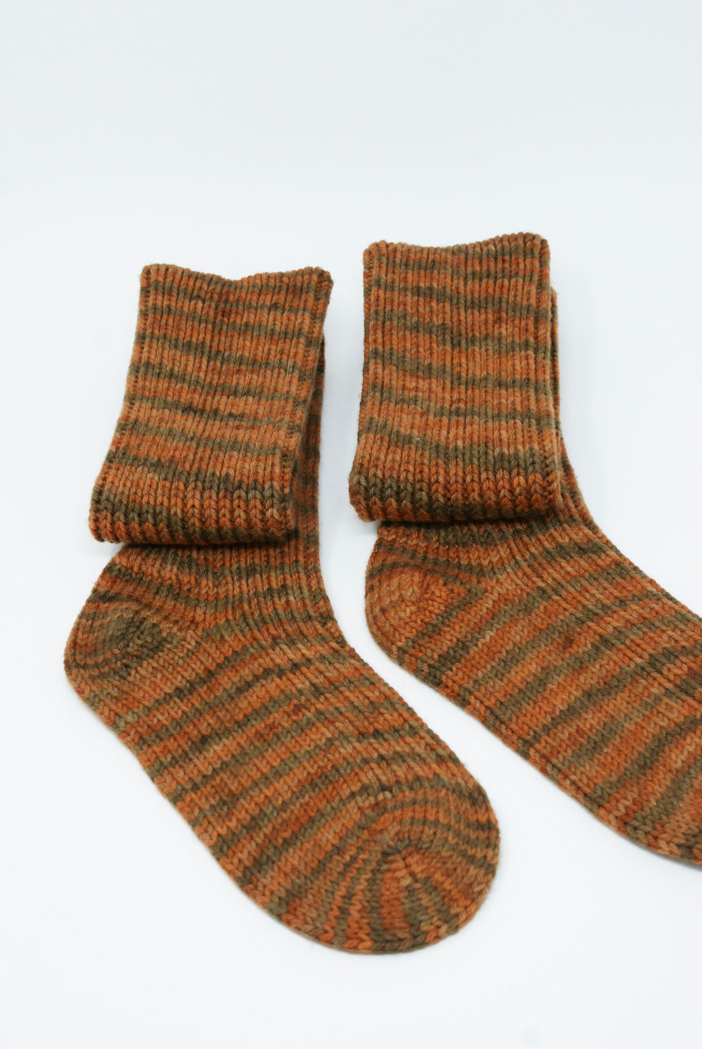 A pair of Misha & Puff Long Wool Socks in Gingerbread Space Dye made with soft merino wool, displayed on a clean white background.