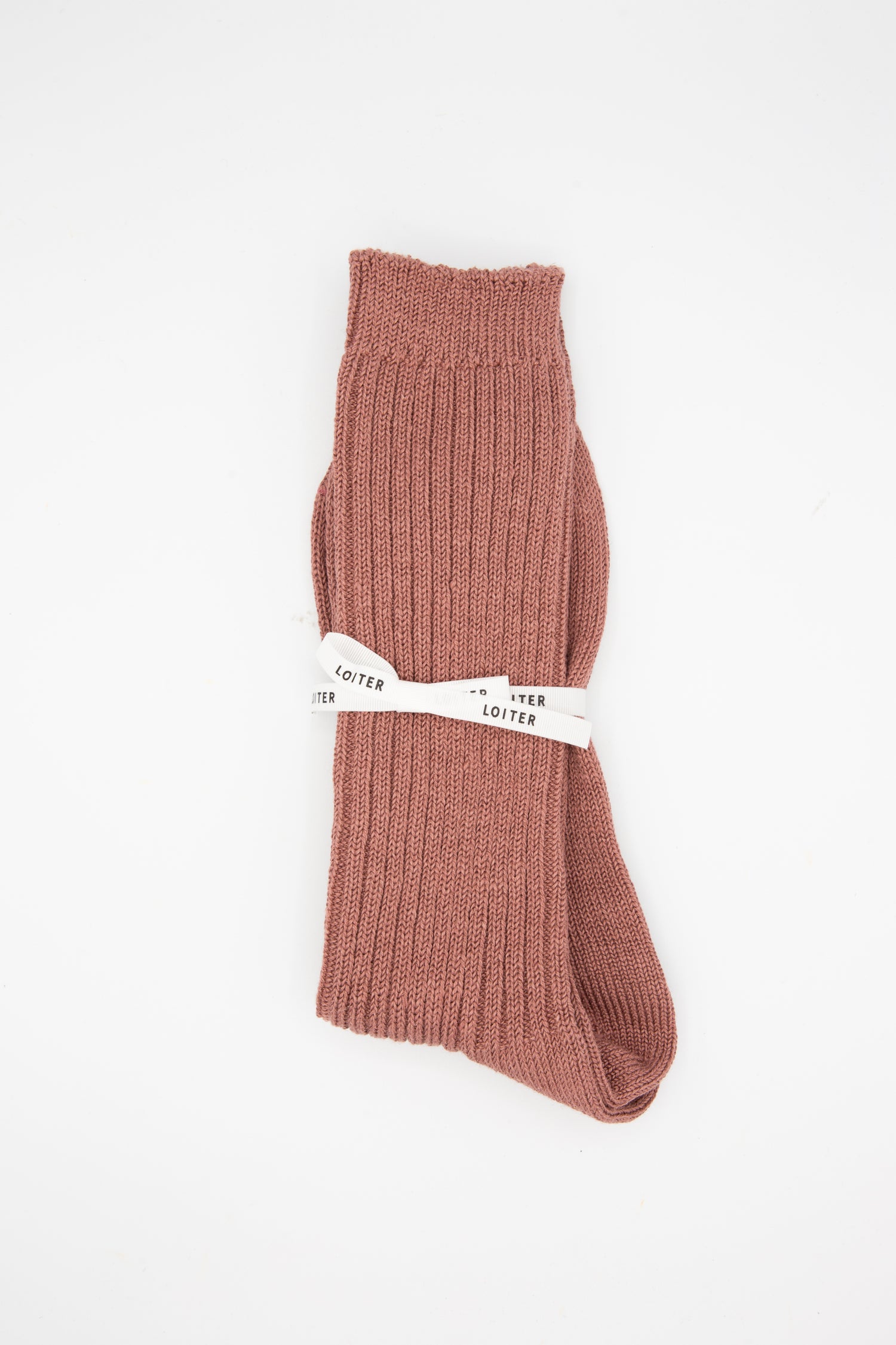 A pair of Linen Rib Sock in Smoke Pink, delicately crafted by Ichi Antiquités in Japan, showcased against a pure white background.