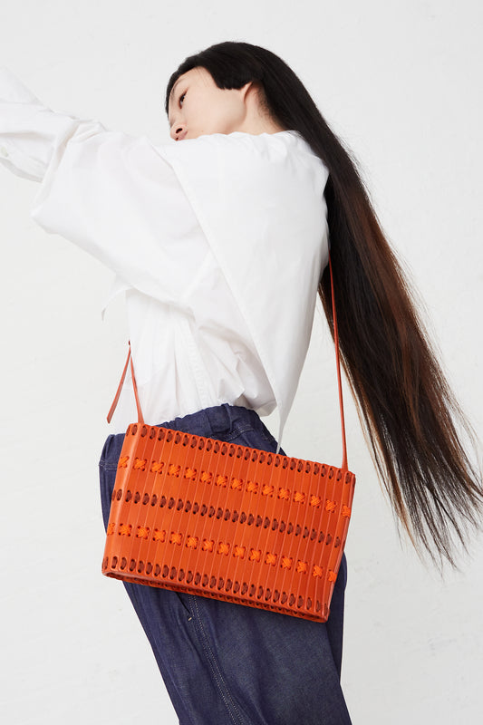 Hatori - Shoulder Bag 60 in Clementine:Tangerine:Spice full front view on model.