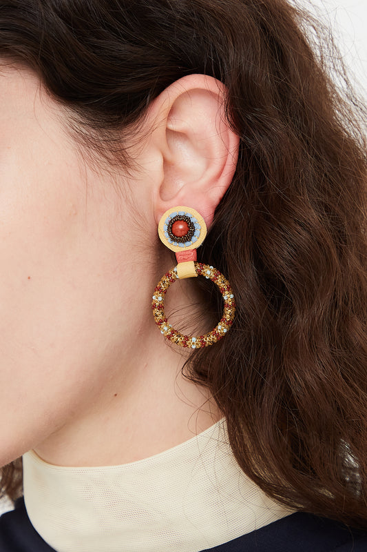 A woman wearing Small Beaded Hoops in Red Jasper Tops by Robin Mollicone.